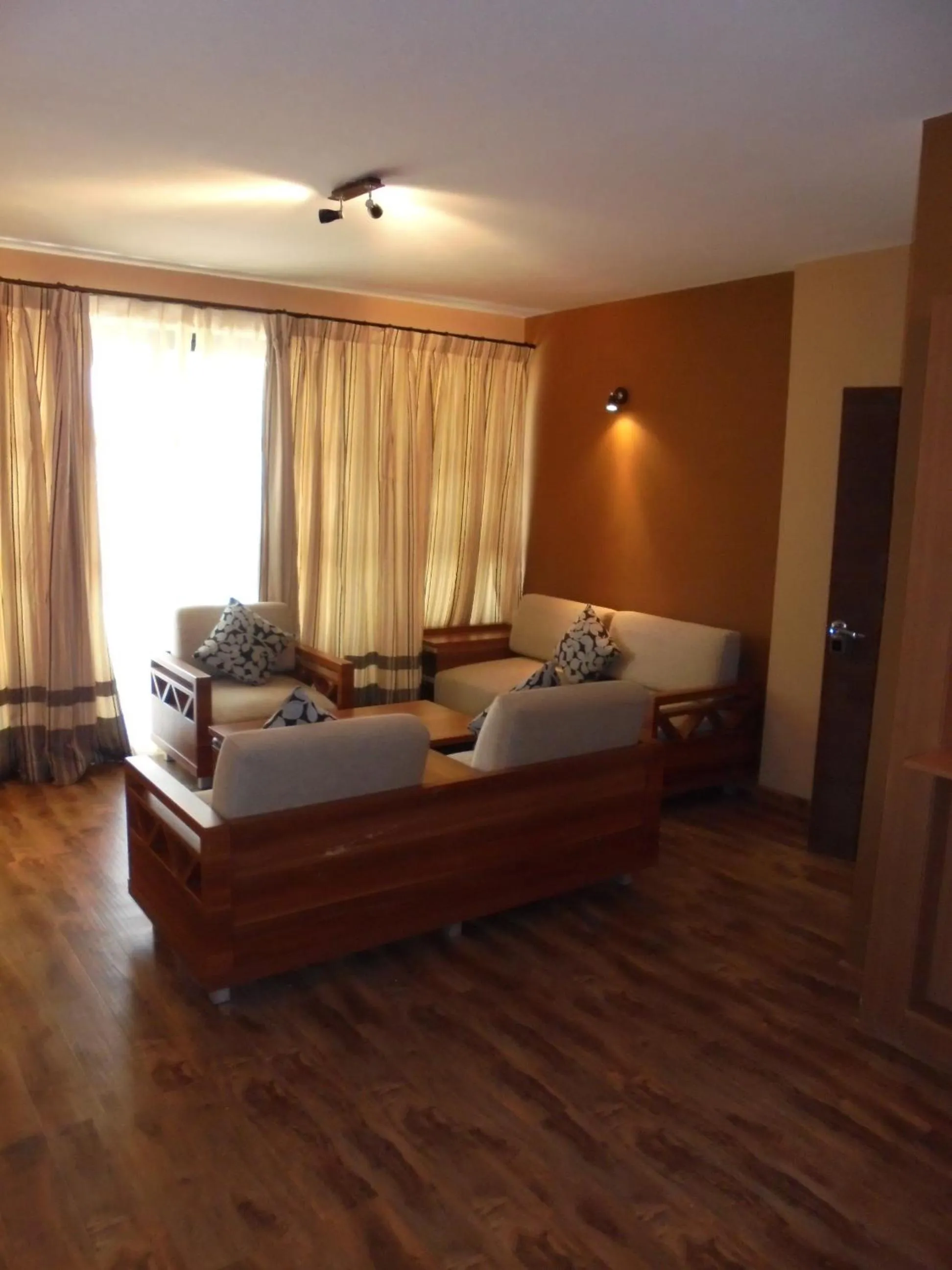 Living room, Bed in We Hotel and Suites