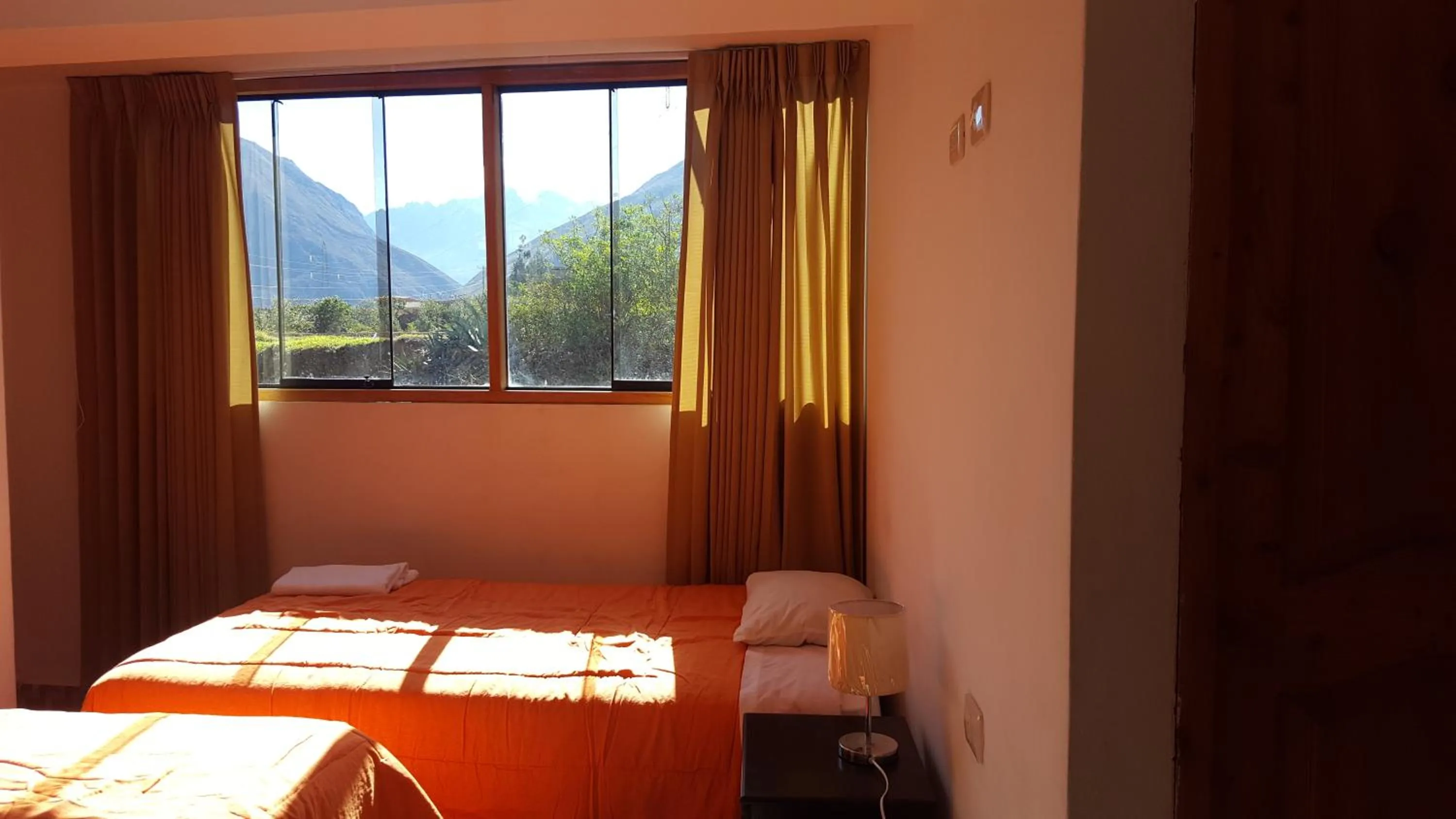 Bed in Tambo de Ollantay Hotel