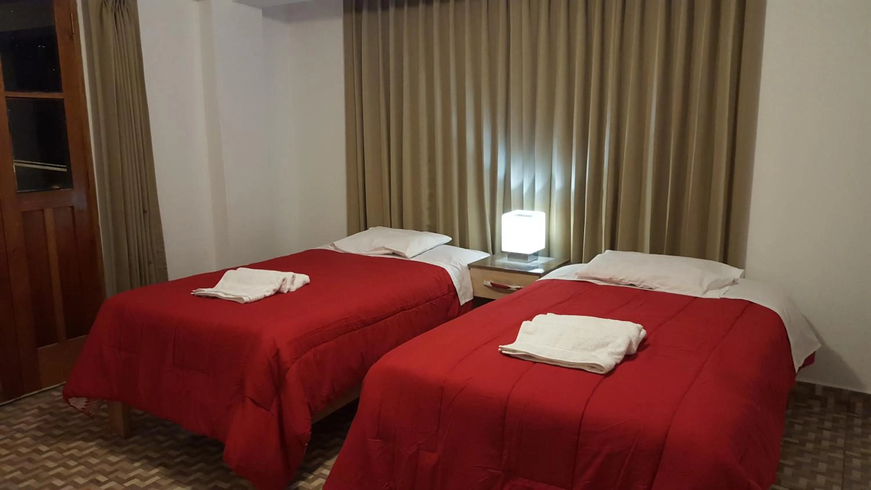 Bed in Tambo de Ollantay Hotel