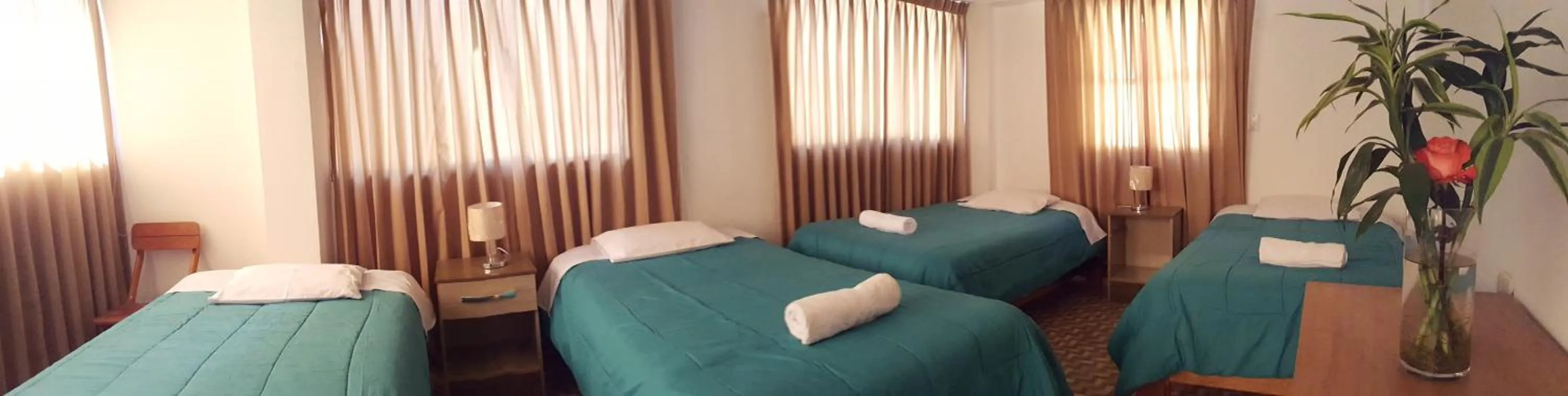 Bed in Tambo de Ollantay Hotel