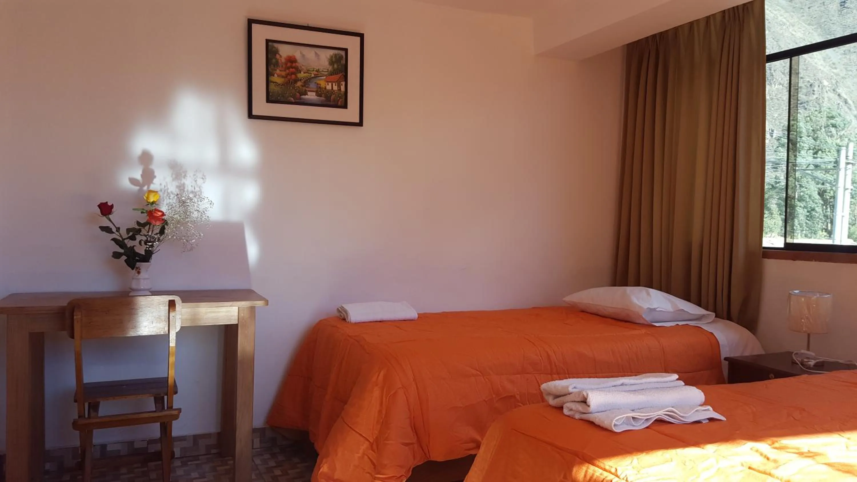 Bed in Tambo de Ollantay Hotel