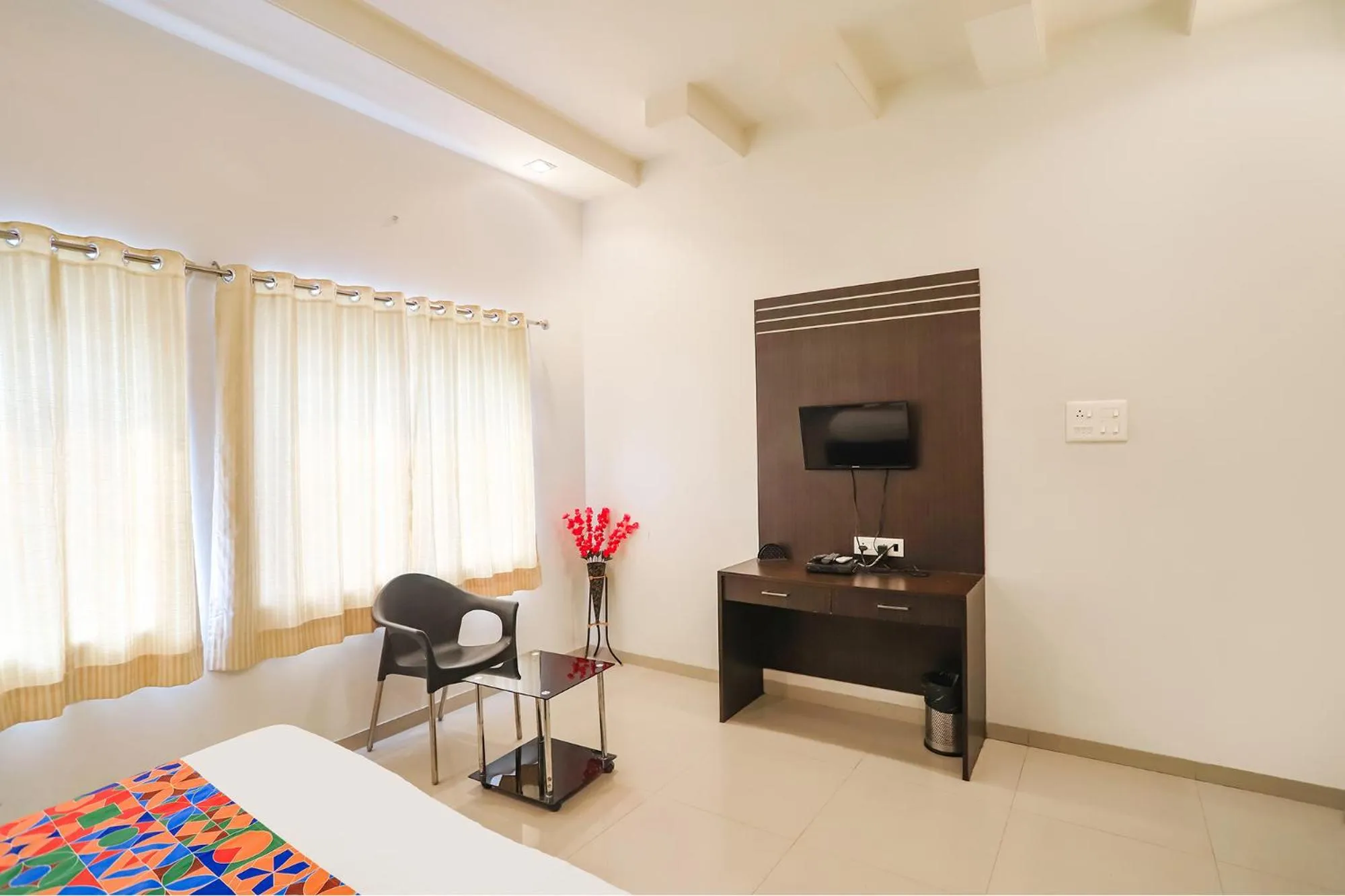 Bed in FabHotel Archanil Apartment - Sitanagar Cricket Ground