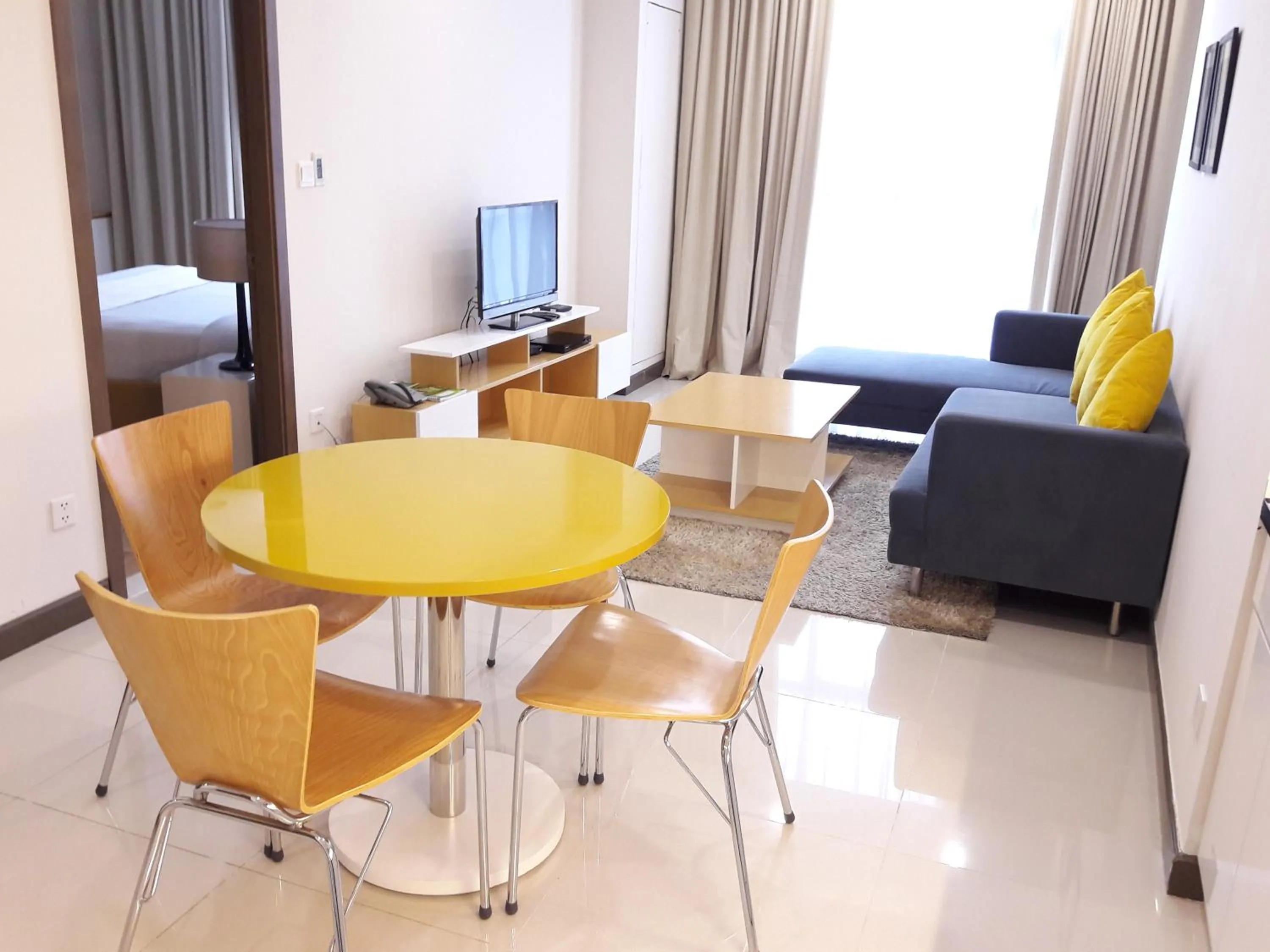 Living room, Bed in Bluesky Serviced Apartment Airport Plaza
