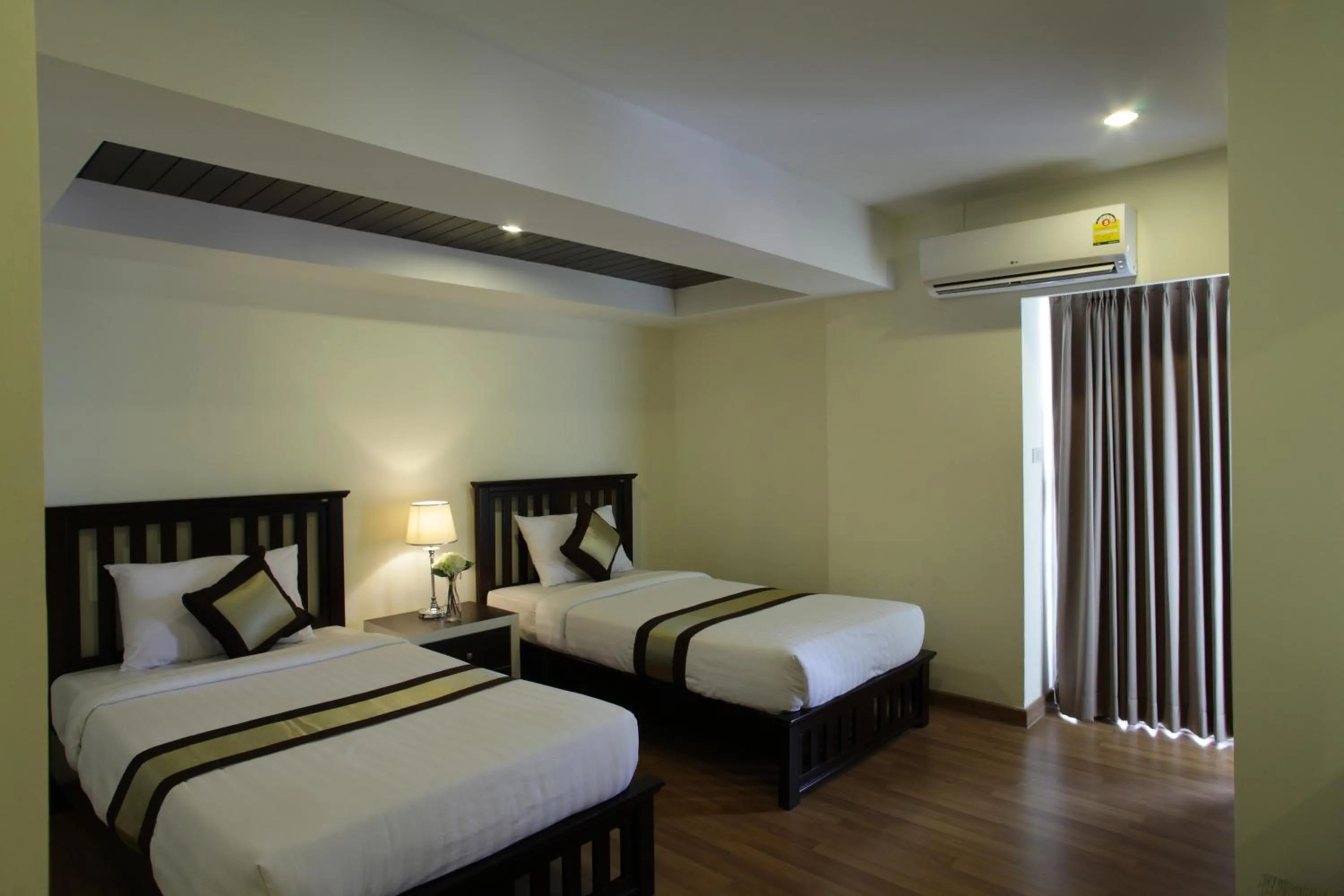 Bed in Nanatai Suites