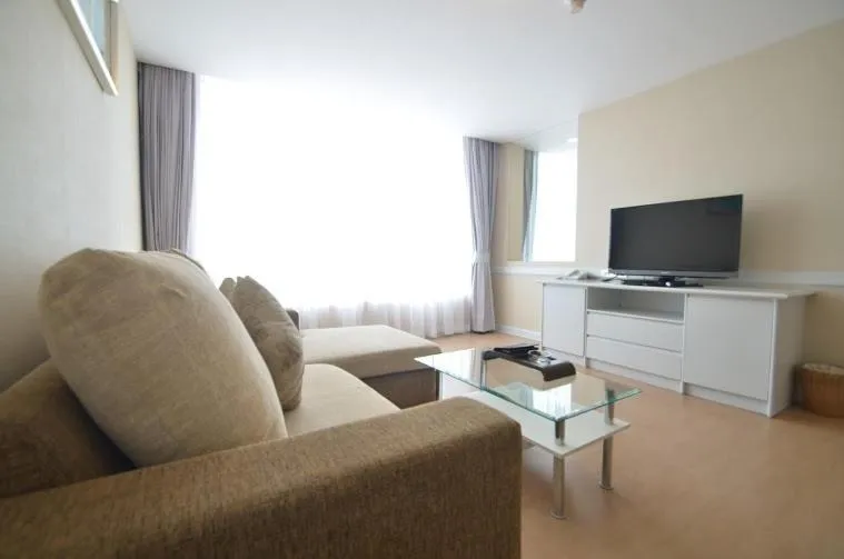 Communal lounge/ TV room in The City Hotel Sriracha by BBH Japan