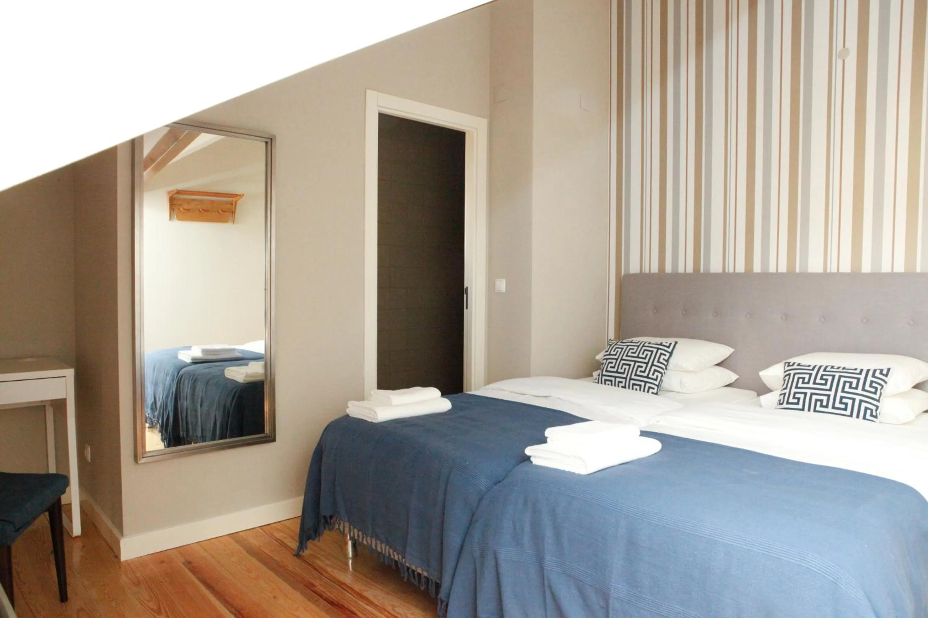 Bed in Flores Guest House