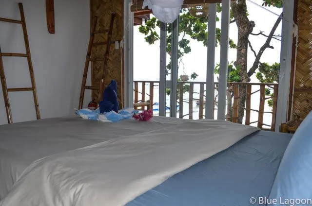 Bed in Blue Lagoon Dive Resort