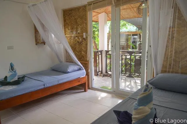 Bed in Blue Lagoon Dive Resort