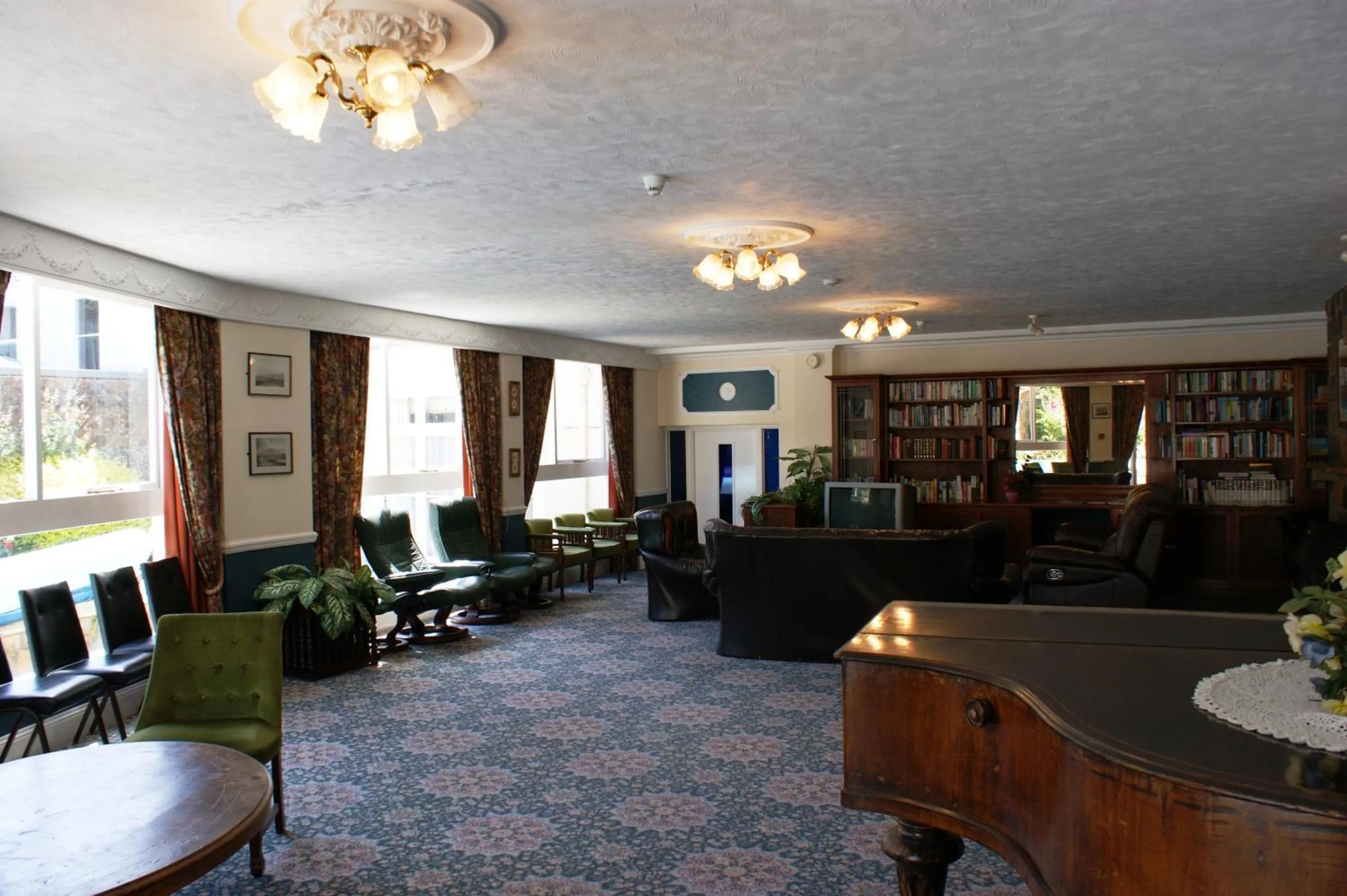 Communal lounge/ TV room in Grange Lodge Hotel