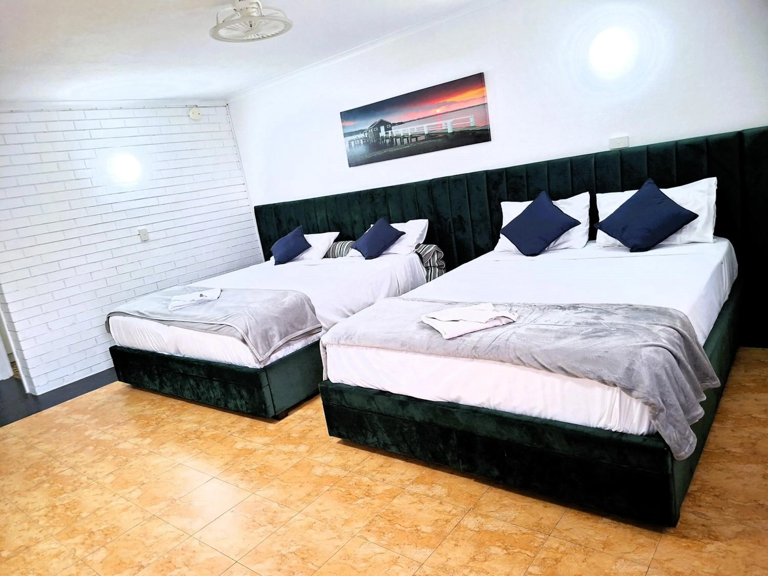 Bed in The Queenslander Motel