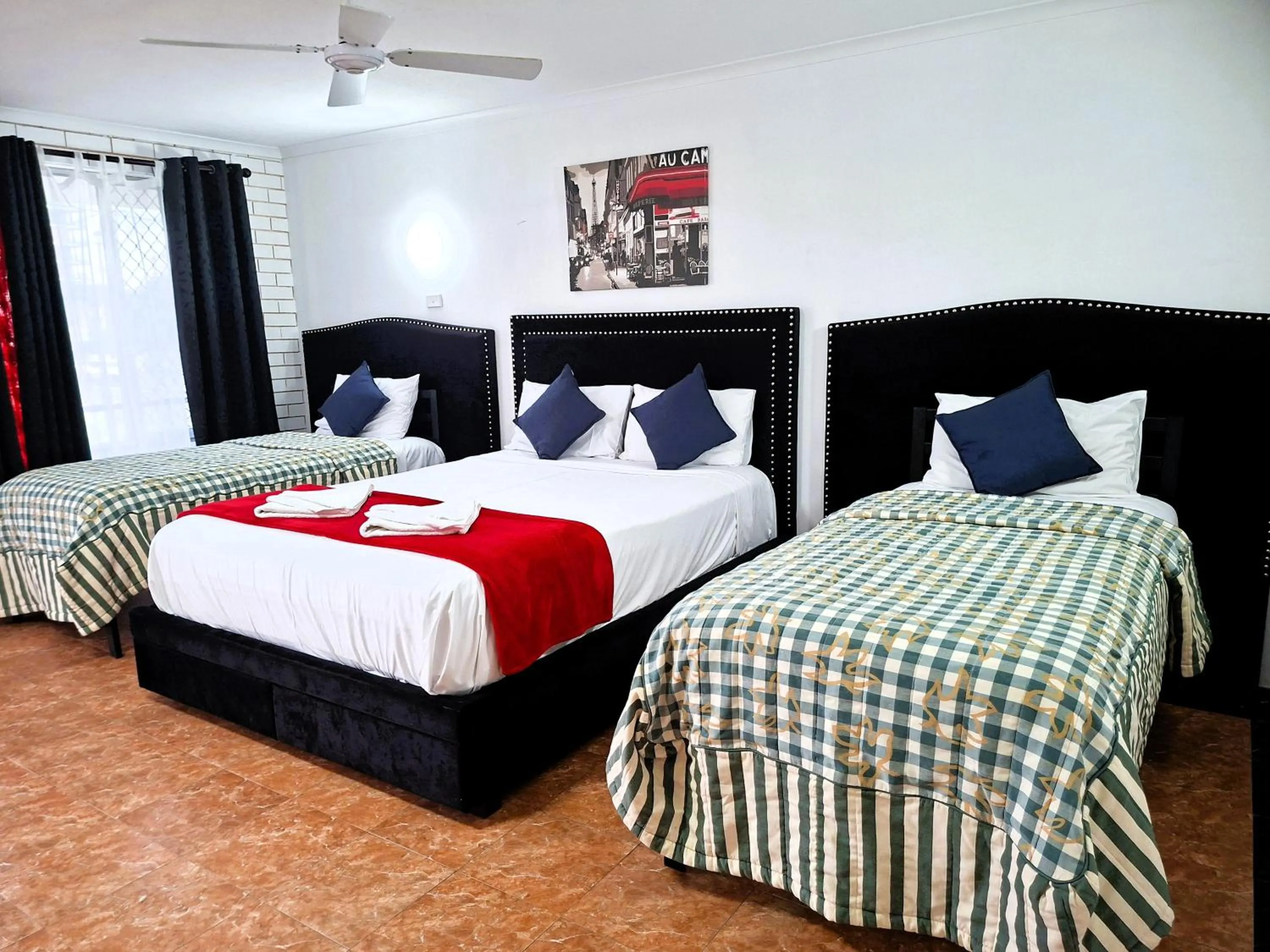 Bed in The Queenslander Motel