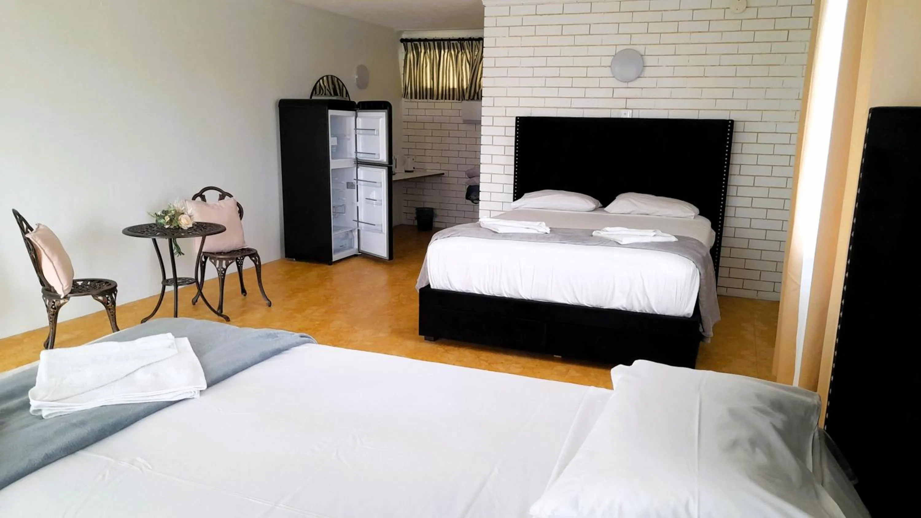 Bed in The Queenslander Motel