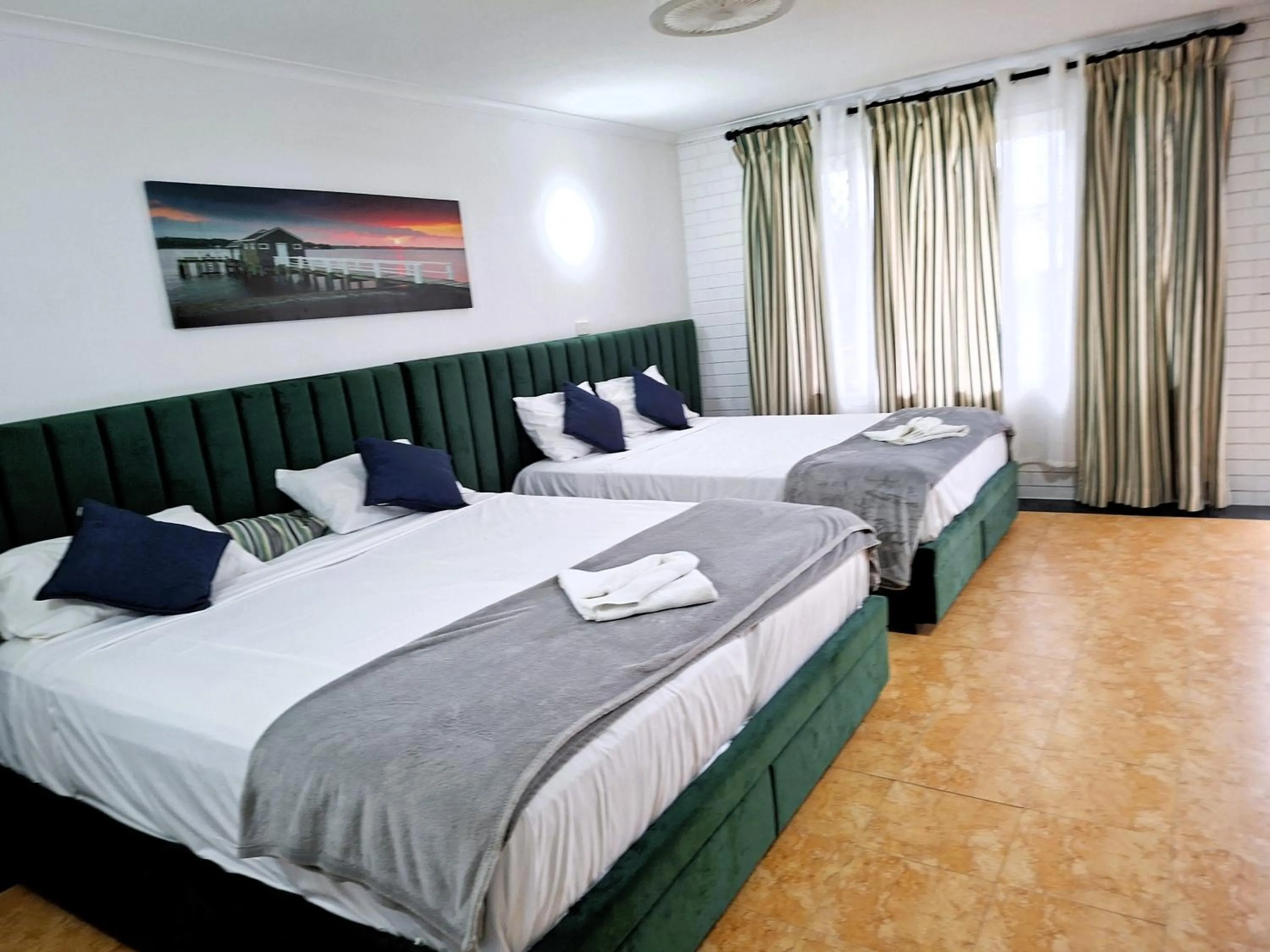 Bed in The Queenslander Motel