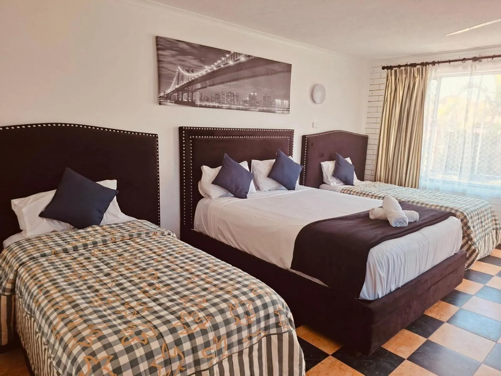 Bed in The Queenslander Motel