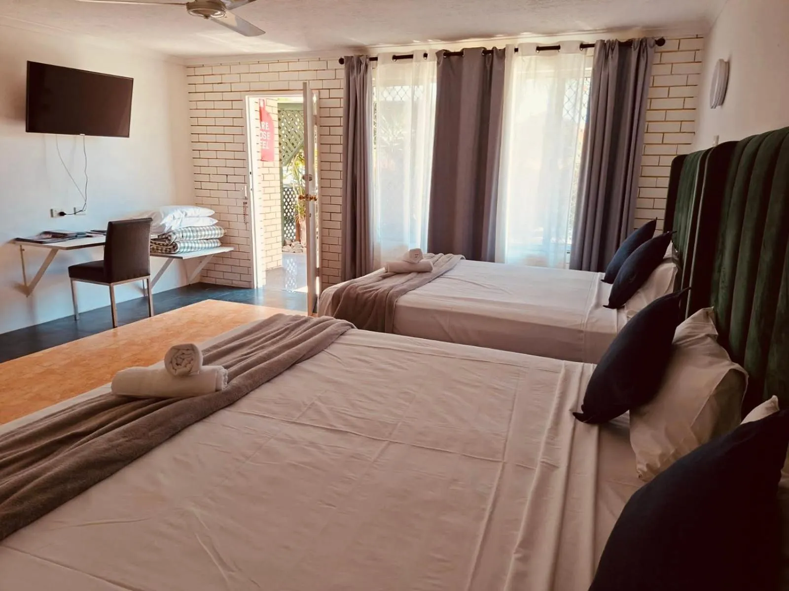 Bed in The Queenslander Motel