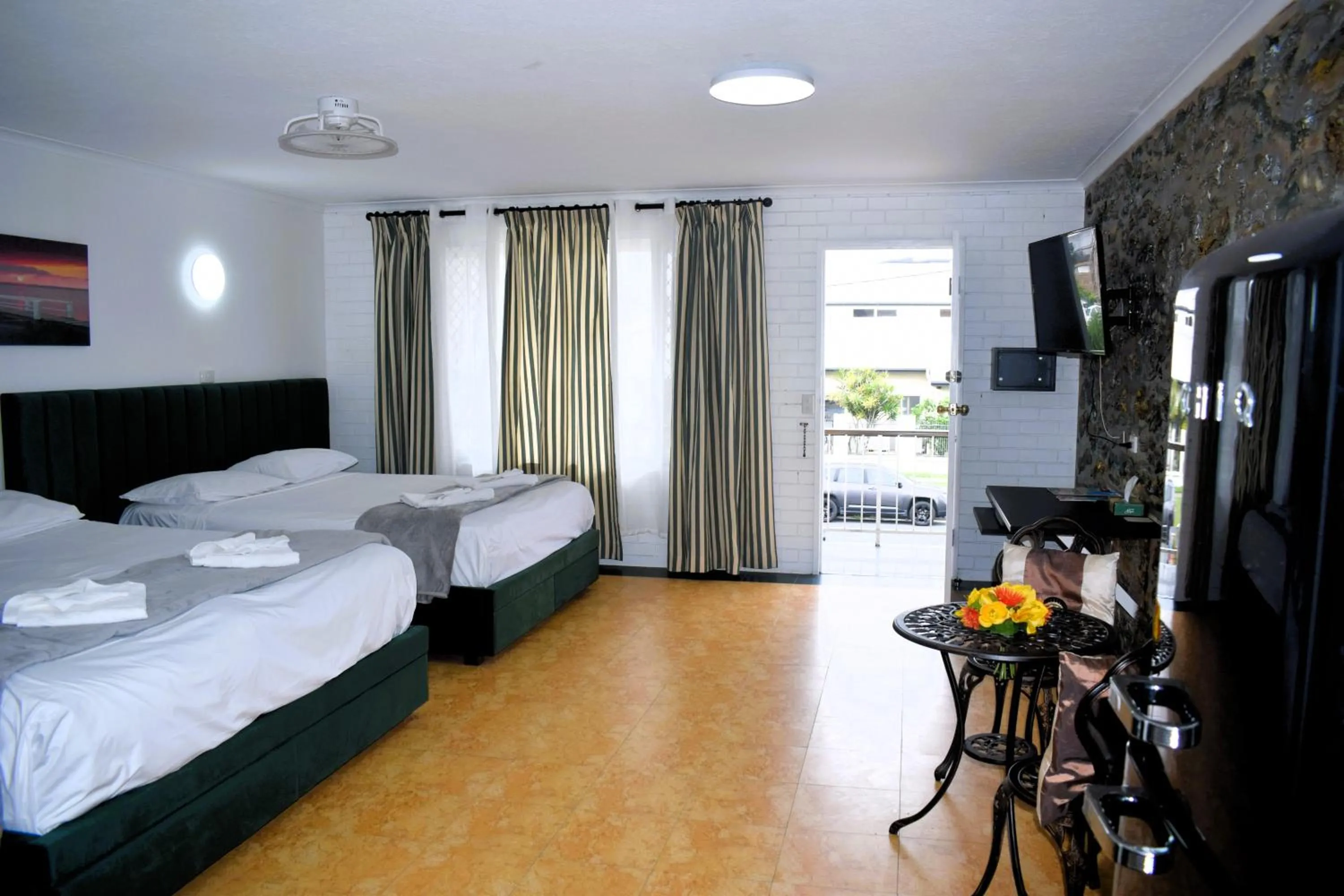 Bed in The Queenslander Motel