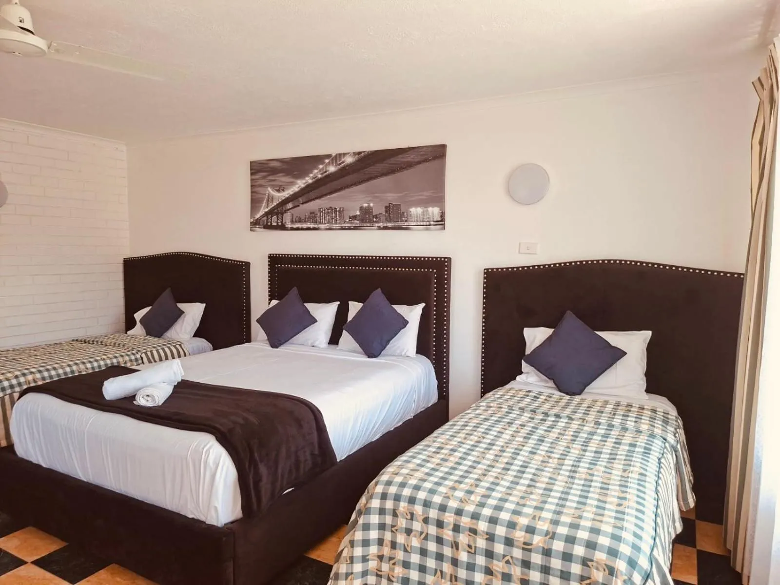 Bed in The Queenslander Motel