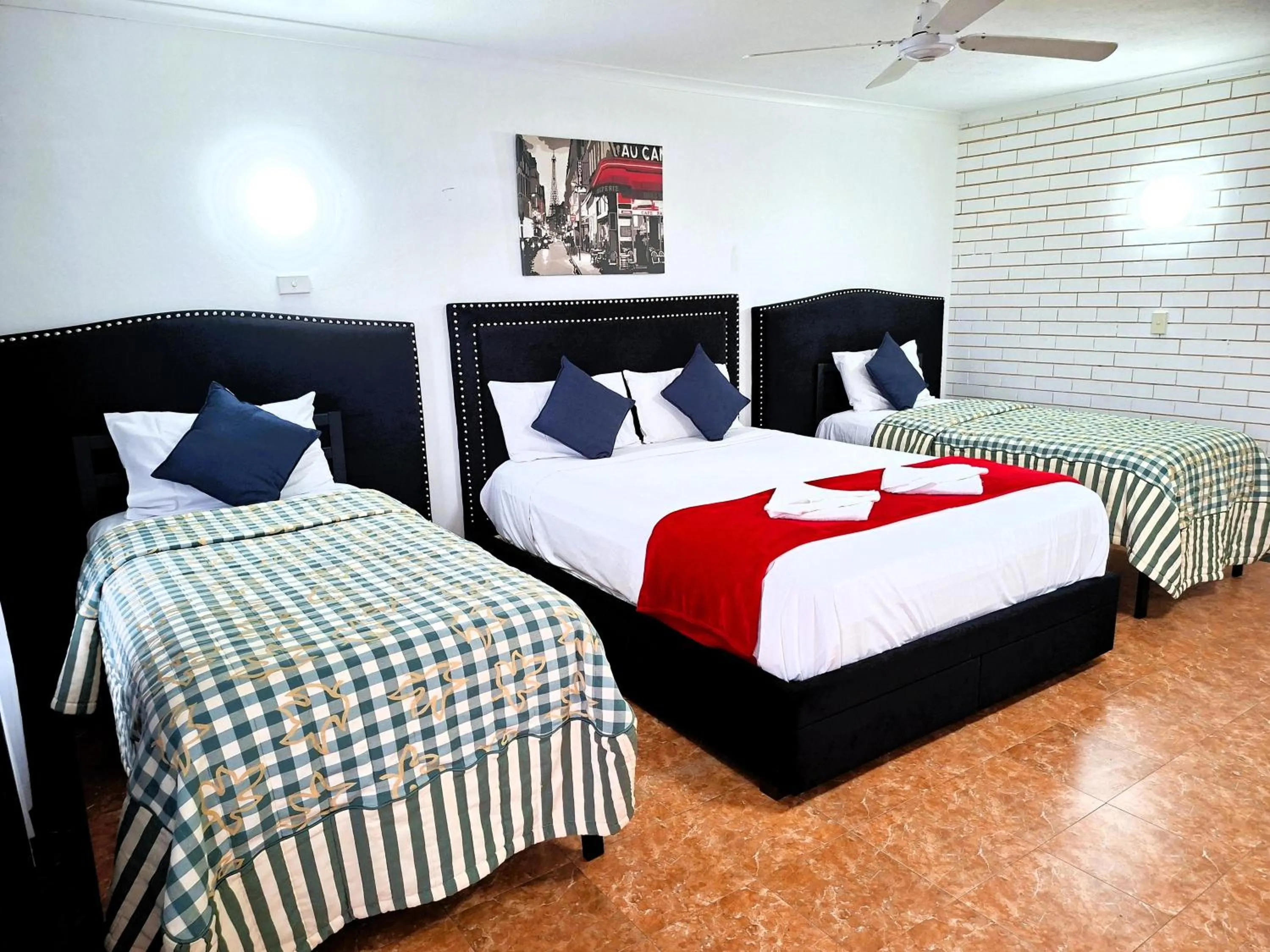 Bed in The Queenslander Motel