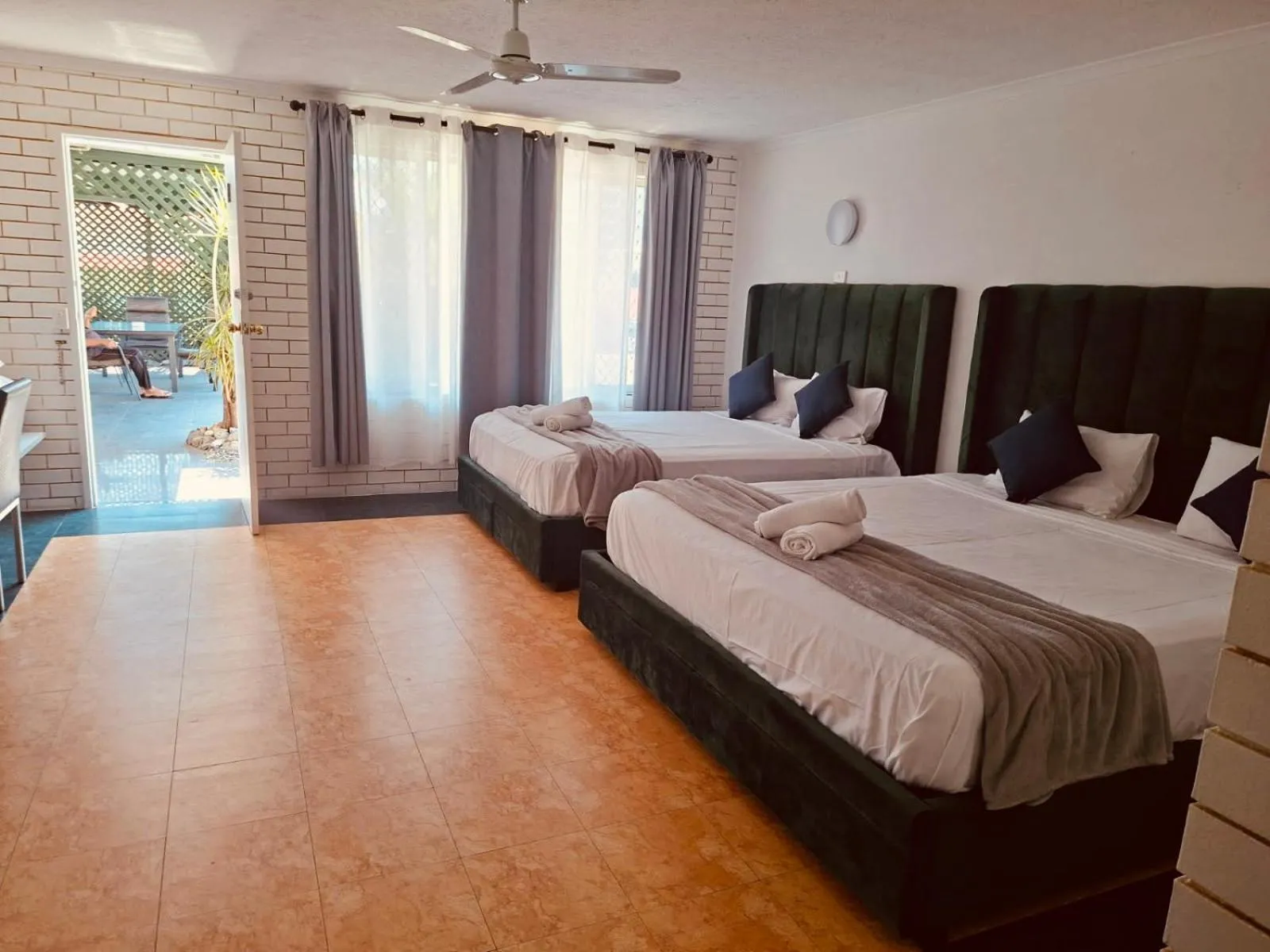 Bed in The Queenslander Motel
