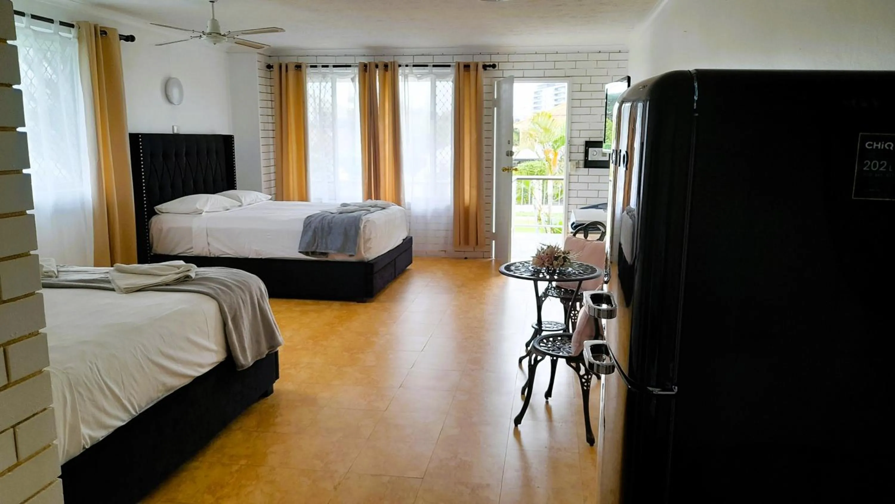 Bed in The Queenslander Motel