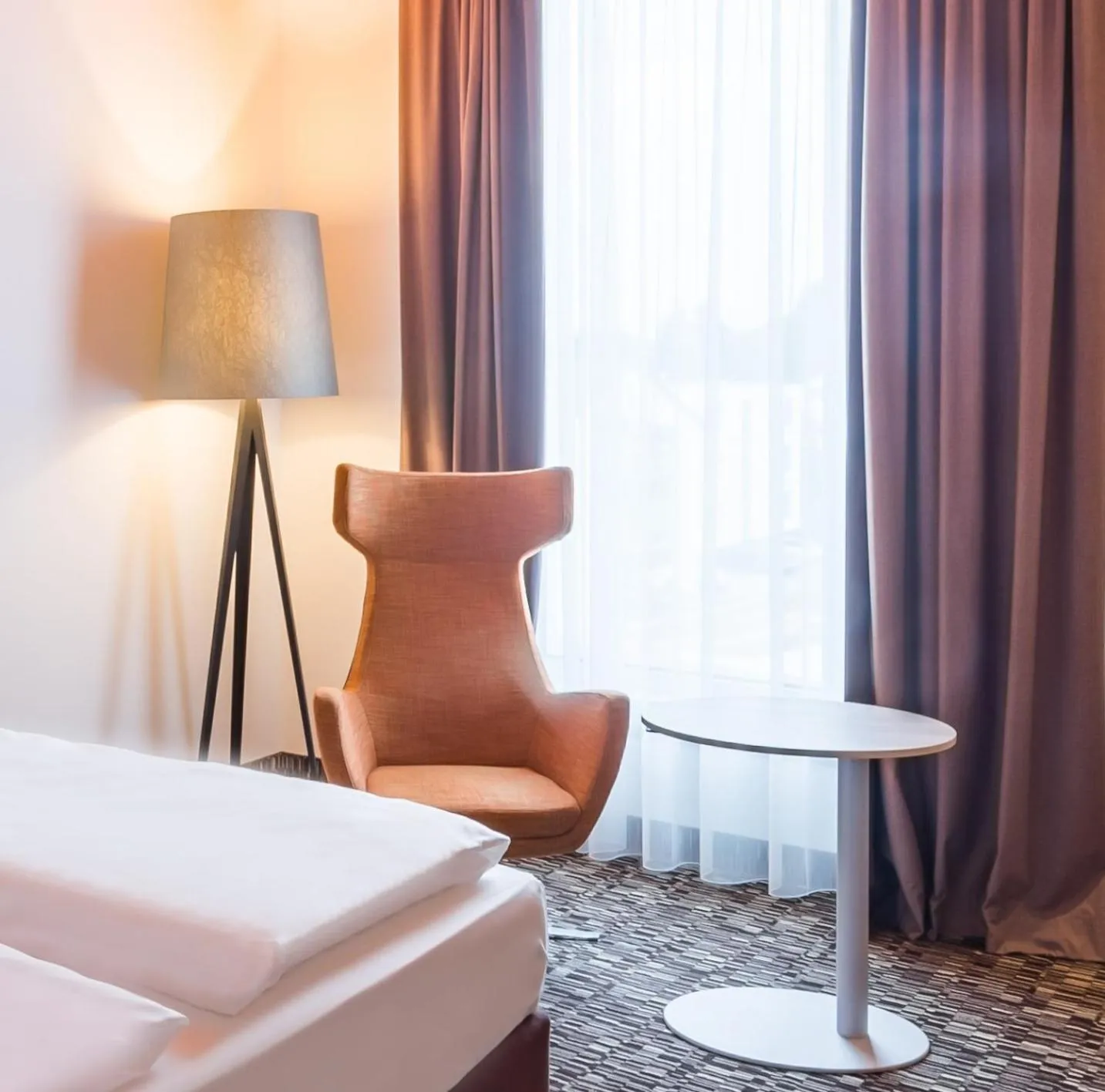 Seating area, Bed in Park Inn by Radisson Neumarkt