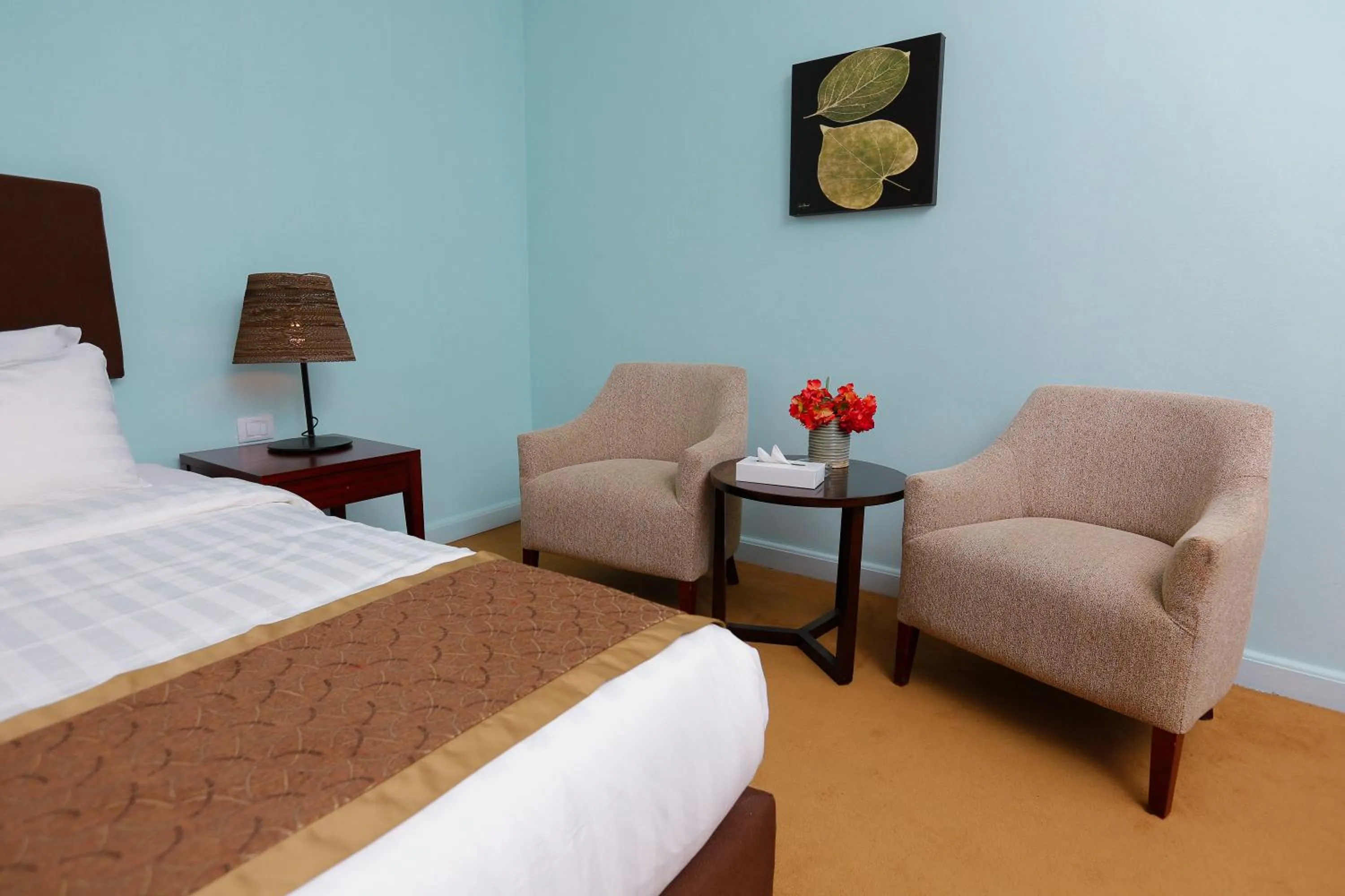 Seating area, Bed in Tolip Family Park Hotel