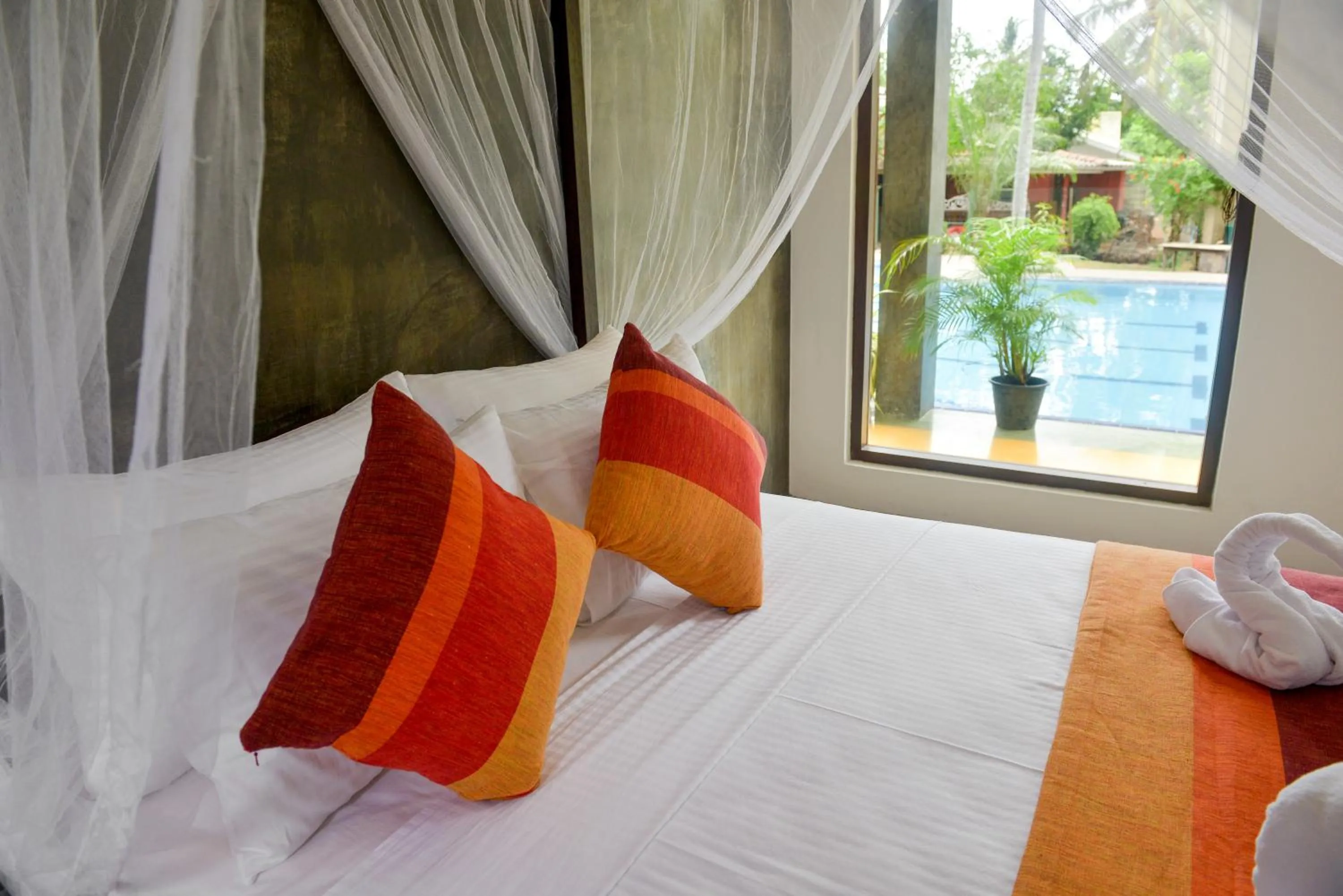 Bed in Olanro Hotel Negombo