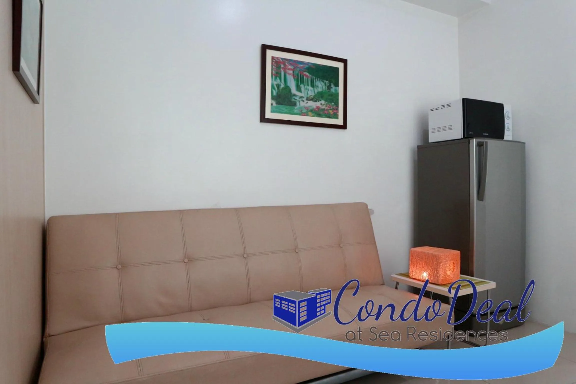 Living room in CondoDeal at Sea Residences