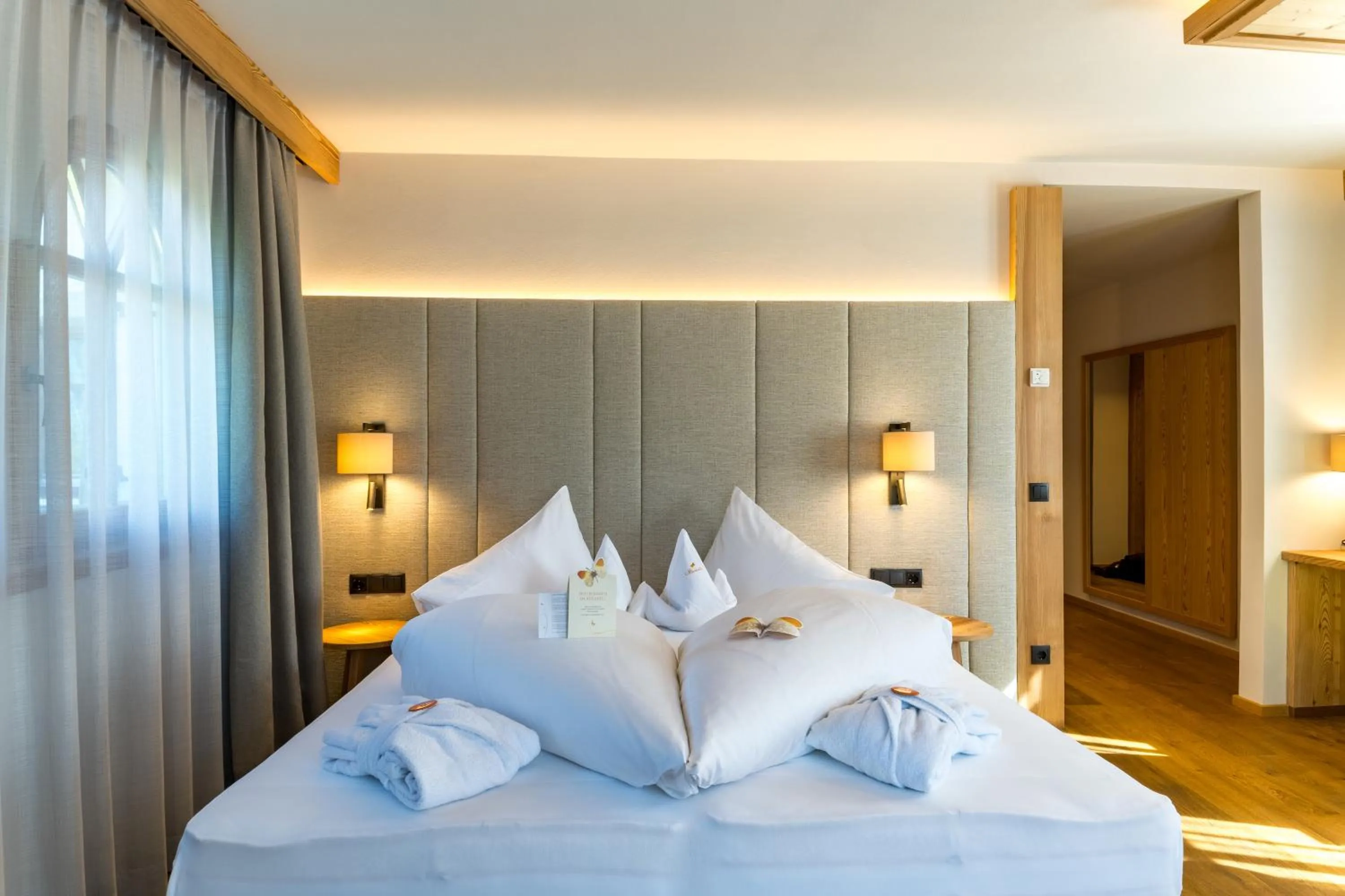 Bed in Mirabell Dolomites Hotel - Luxury Ayurveda & Spa