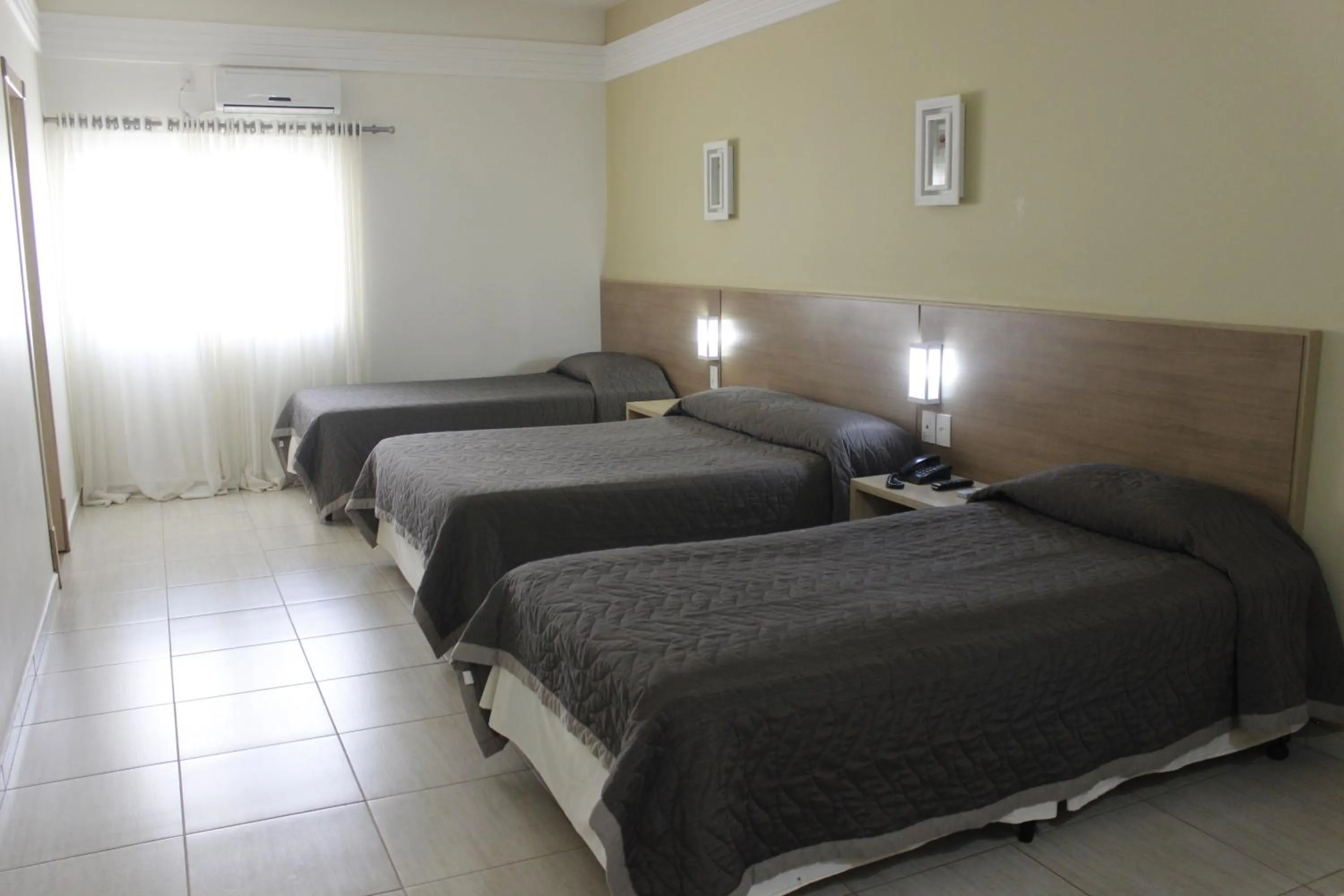 Bed in Francisco Beltrão Palace Hotel