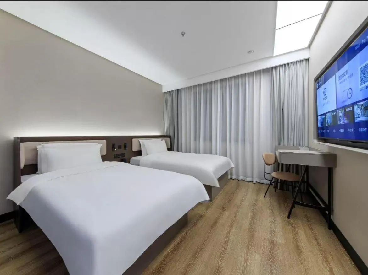 Bed in Hanting Hotel Beijing Fangshan Changyang Subway Station