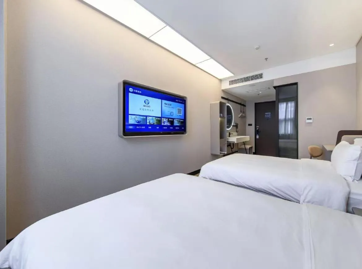 Bed in Hanting Hotel Beijing Fangshan Changyang Subway Station