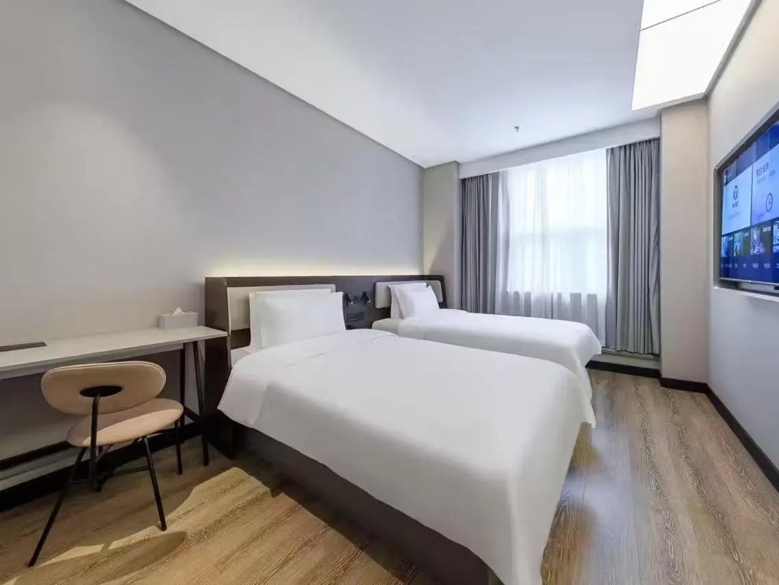 Bed in Hanting Hotel Beijing Fangshan Changyang Subway Station