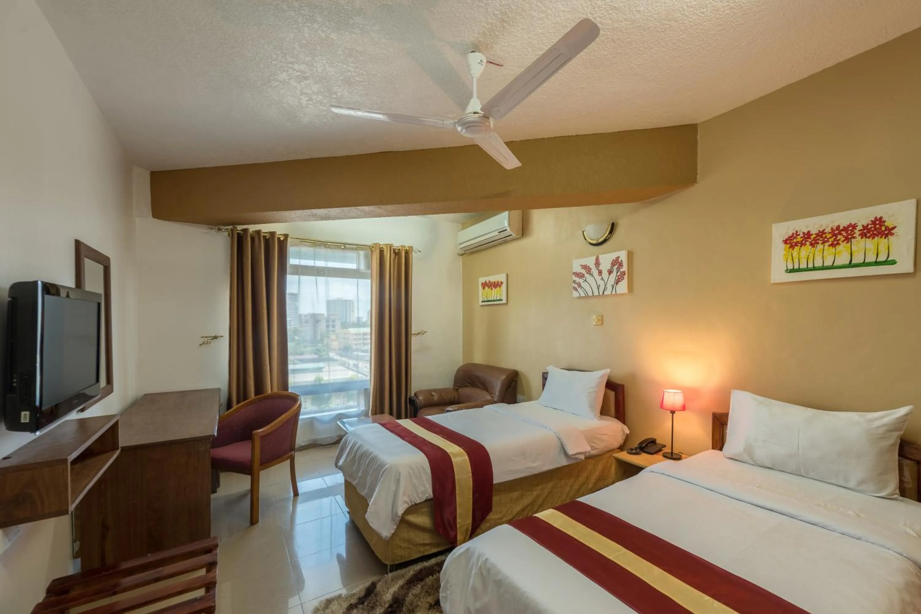 Bed in Hotel Raha Tower