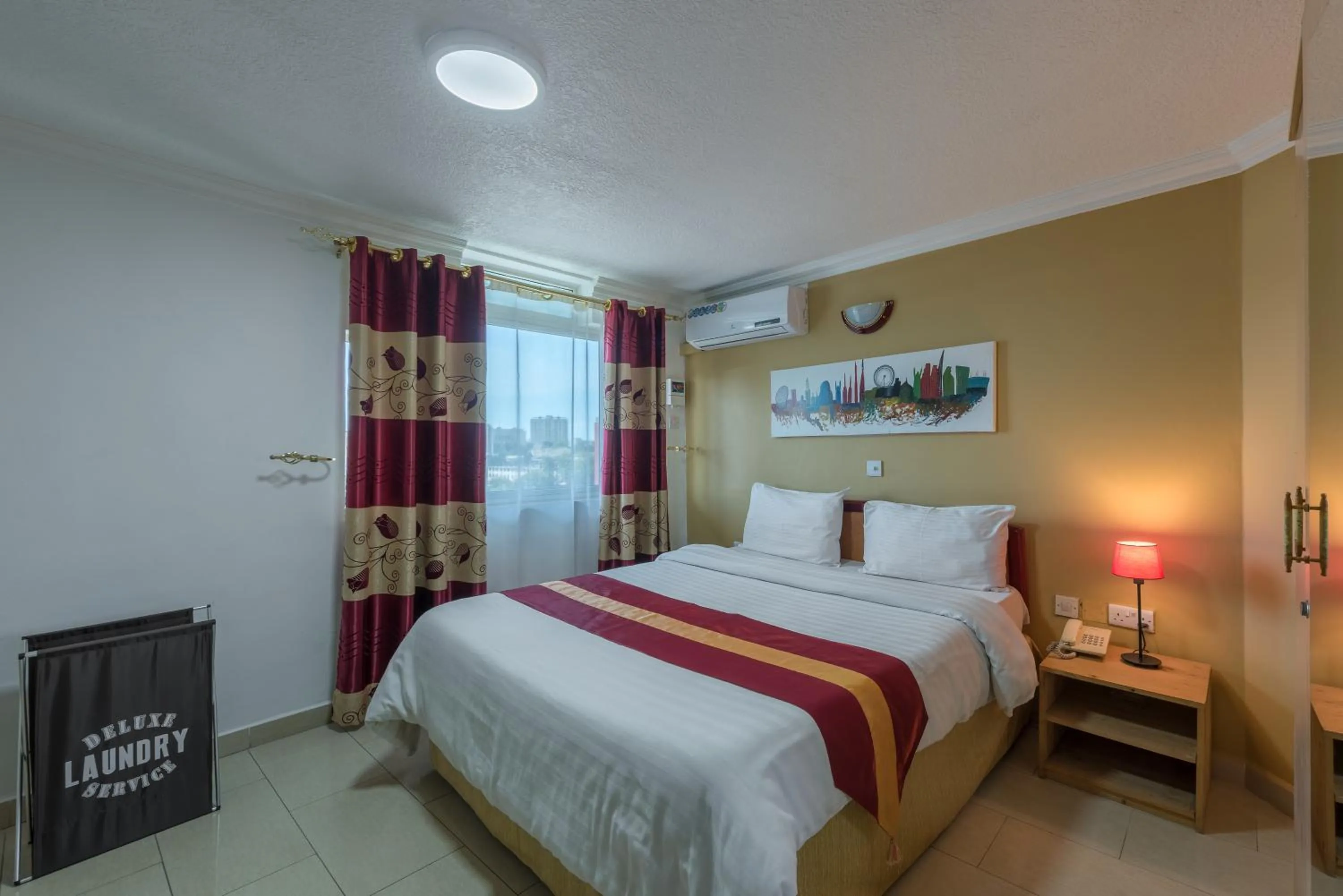 Bed in Hotel Raha Tower