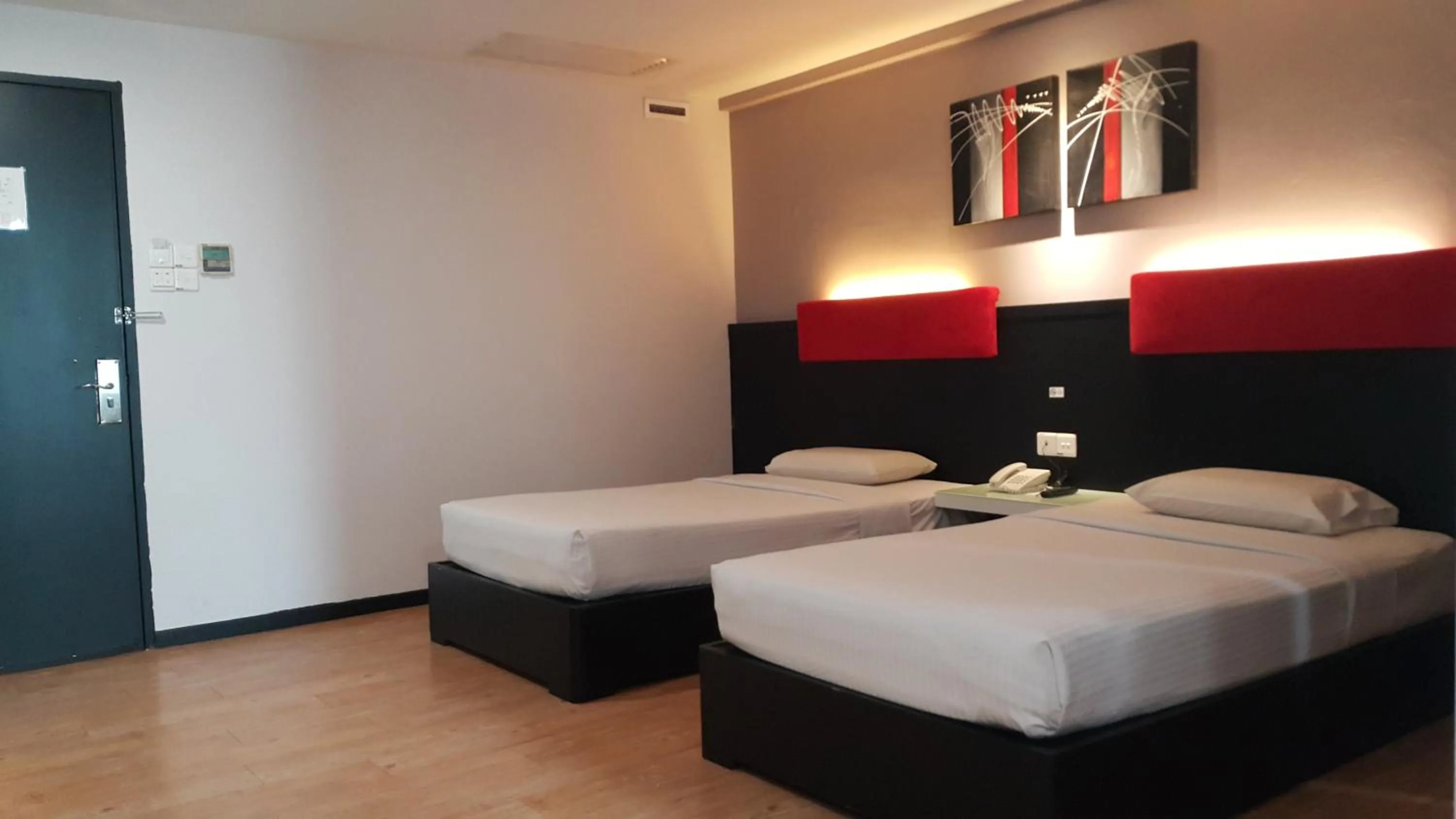 Bed in Red Rock Hotel Penang