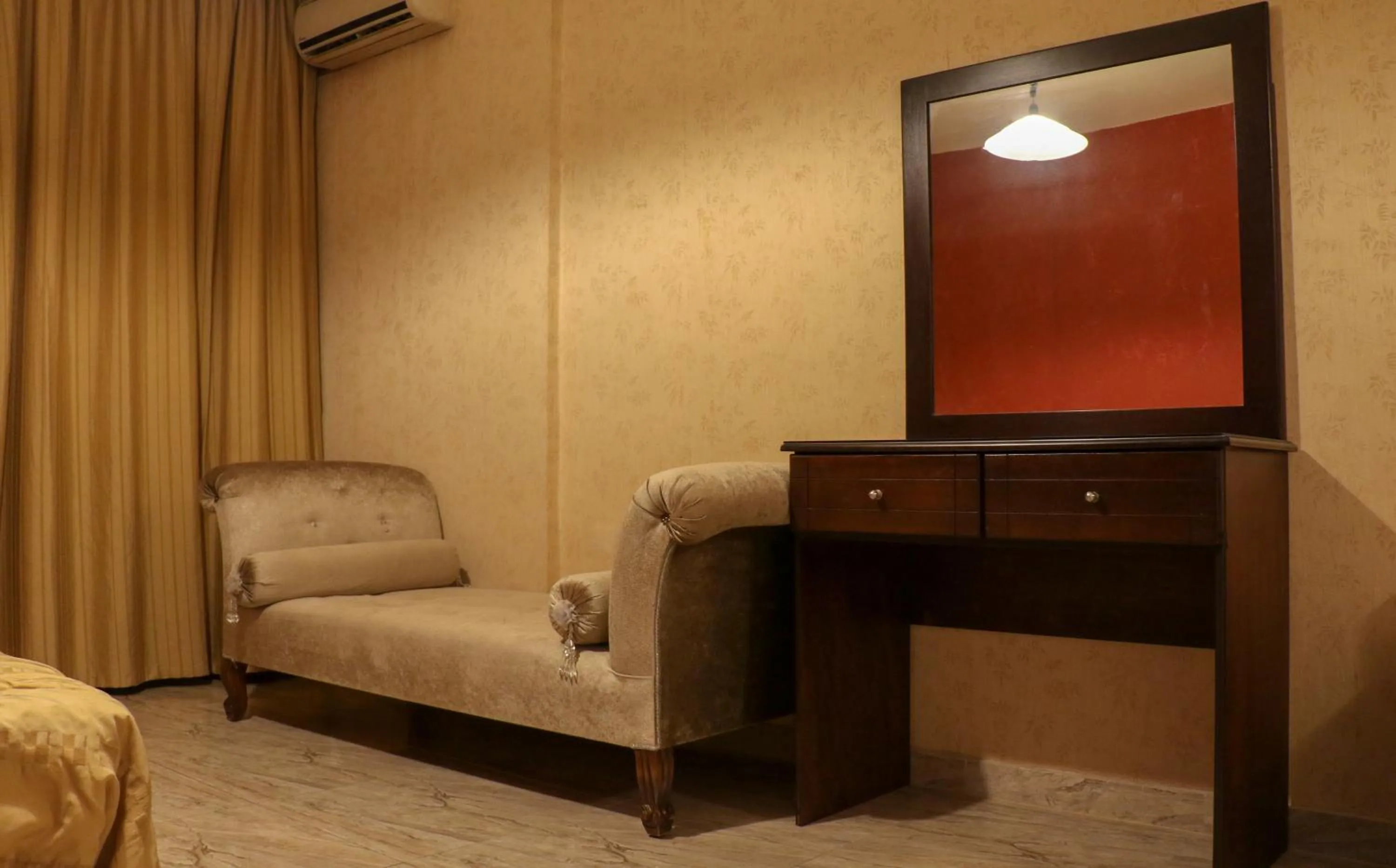 Bed in Grand Suites Hotel