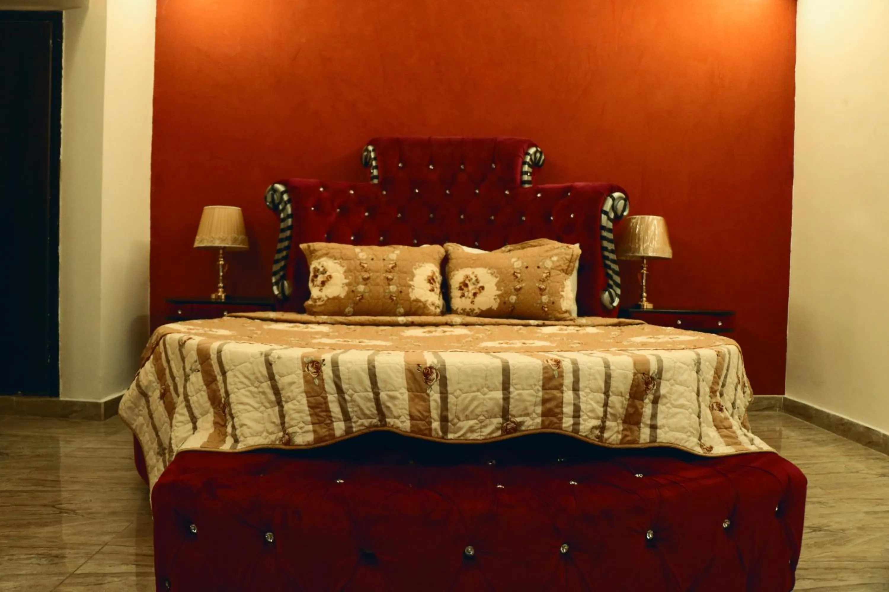 Bed in Grand Suites Hotel