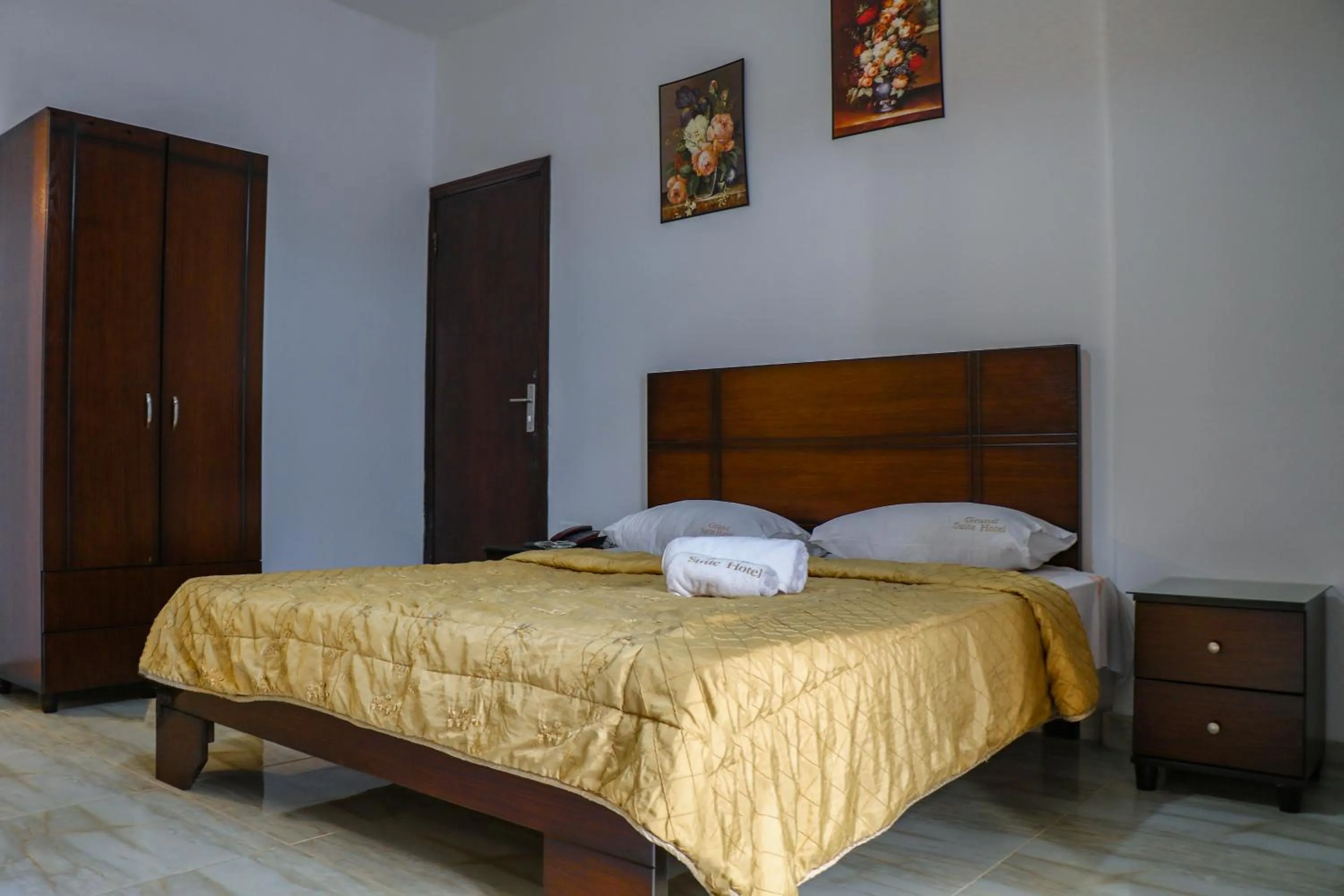 Bed in Grand Suites Hotel