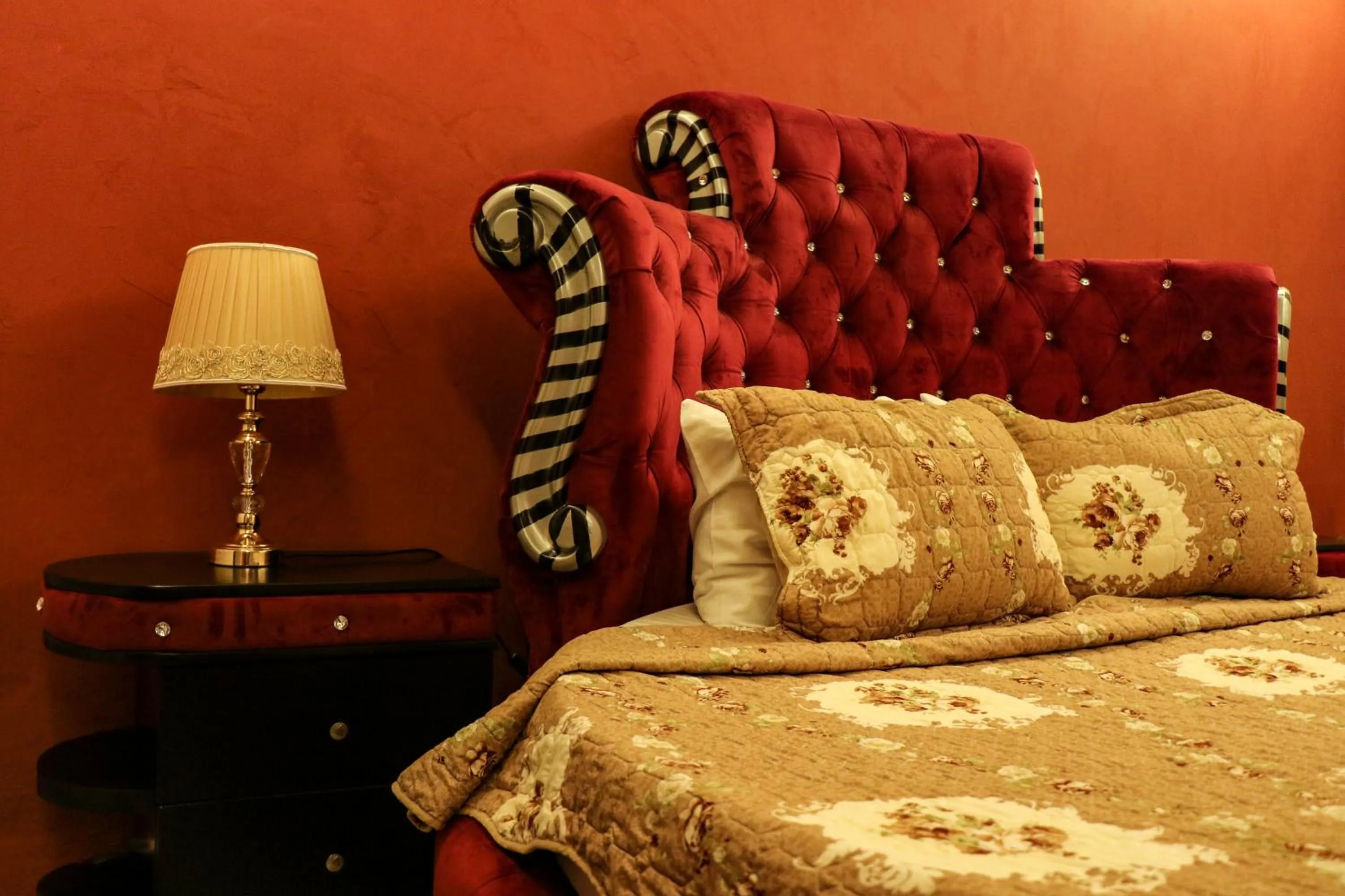 Bed in Grand Suites Hotel