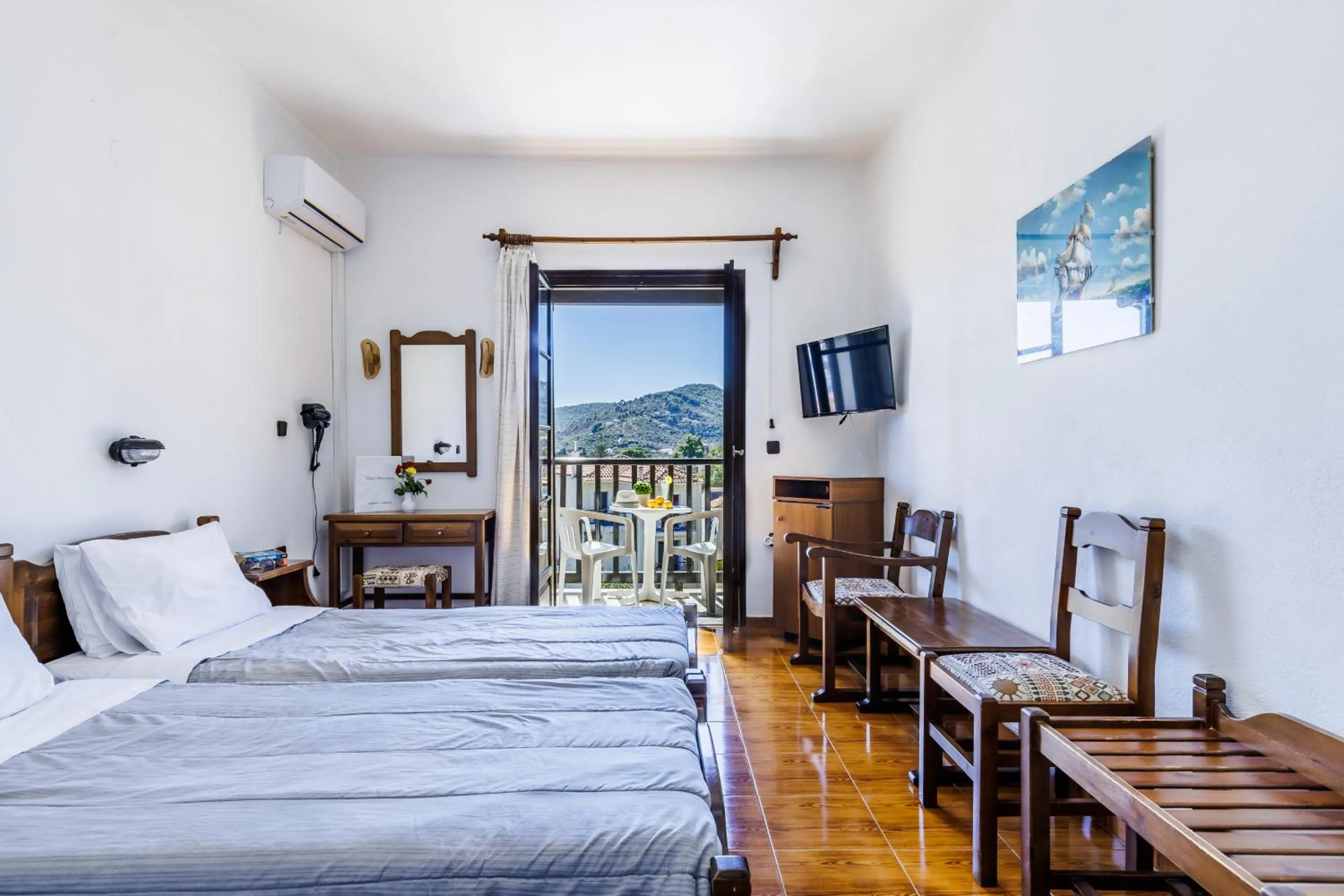 Bed in Hotel Dionyssos