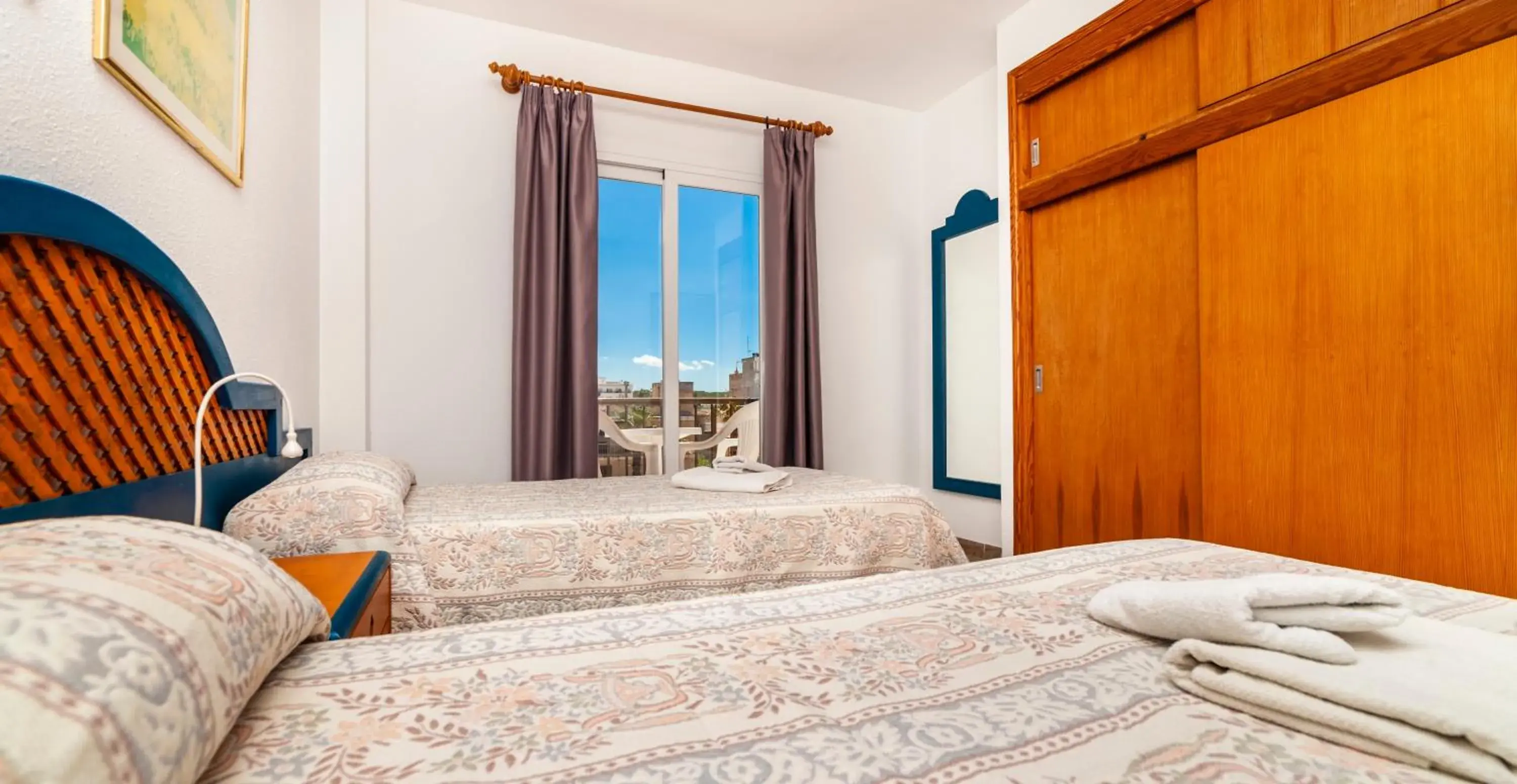 Bedroom, Bed in Apartamentos Charlys Can Picafort Bedroom, Bed in Apartamentos Charlys Can Picafort