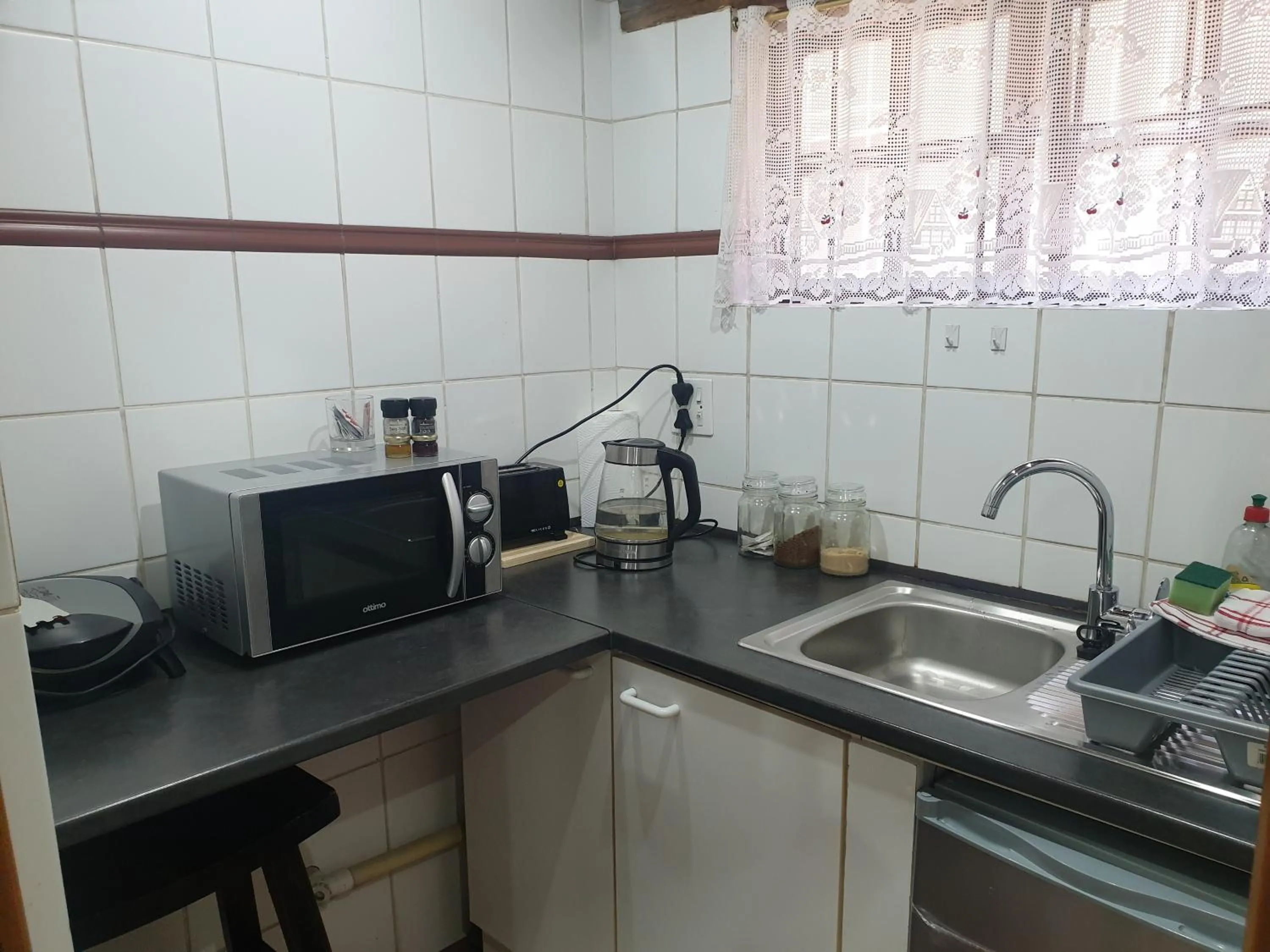 Kitchen or kitchenette in By Appointment Suites