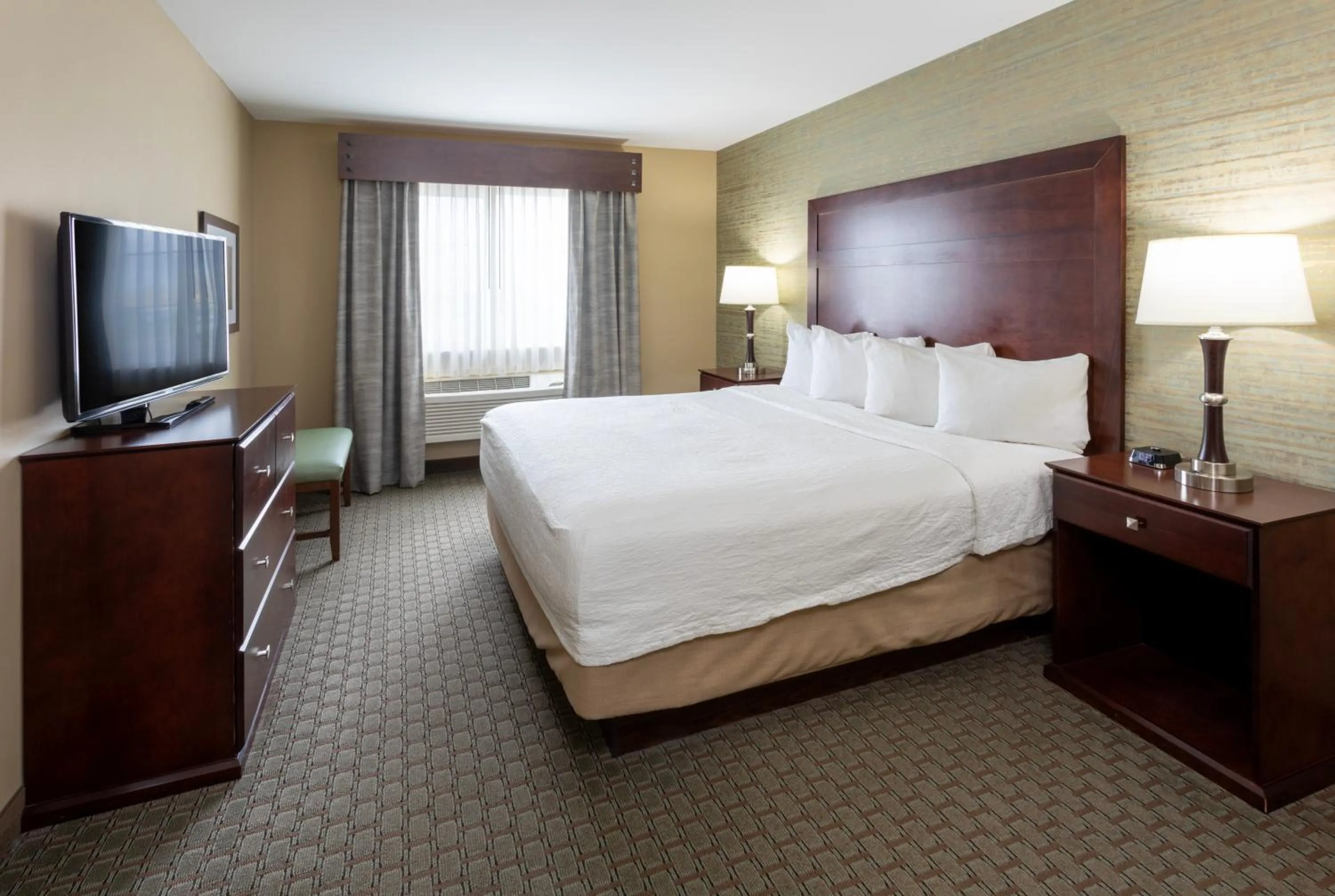 Bedroom, Bed in GrandStay Hotel & Suites - Morris