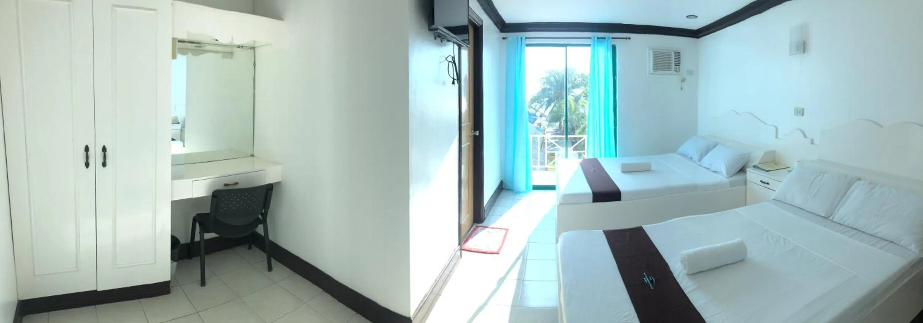 Bed in The Waterfront Beach Resort