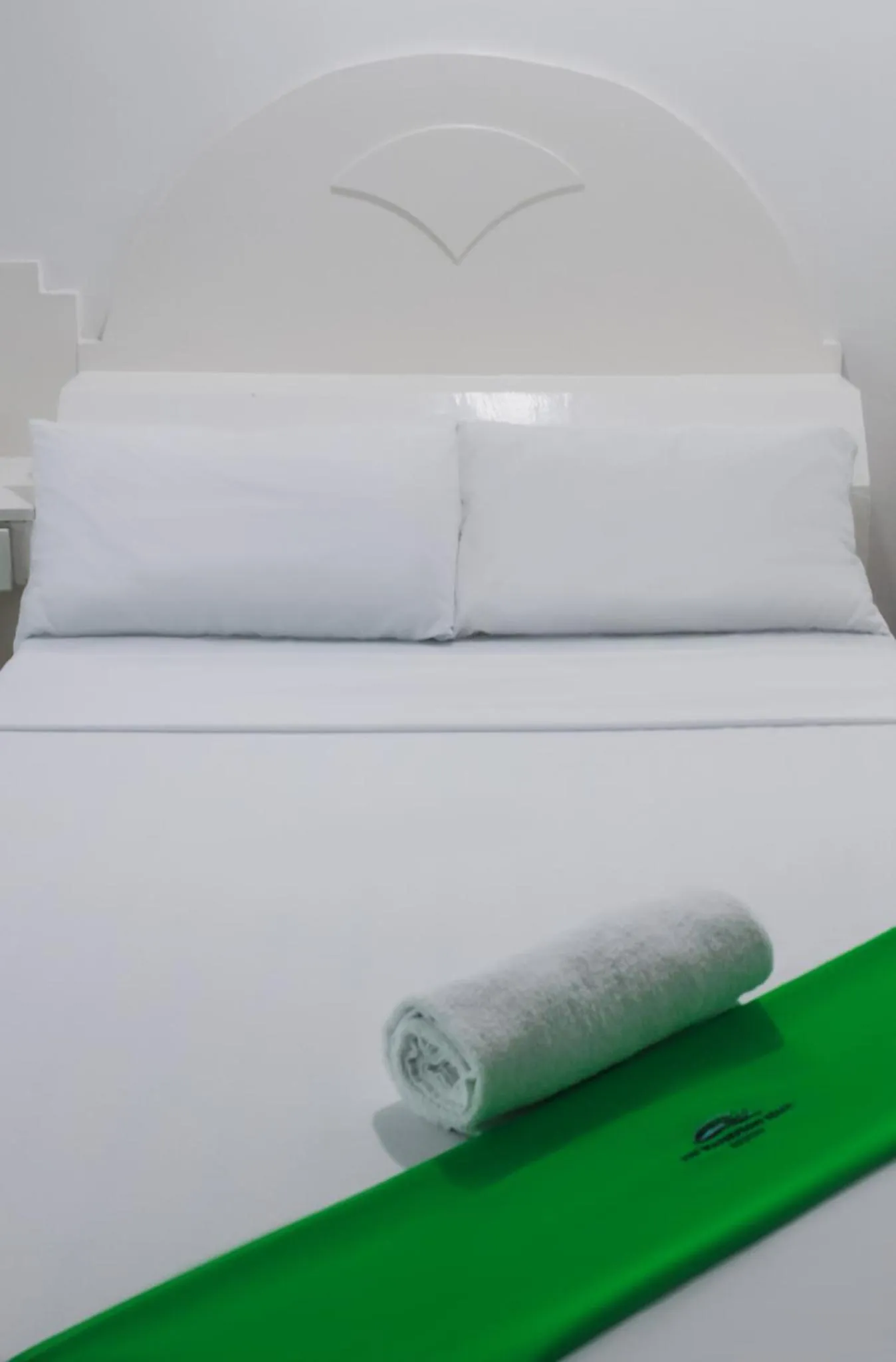 Bed in The Waterfront Beach Resort