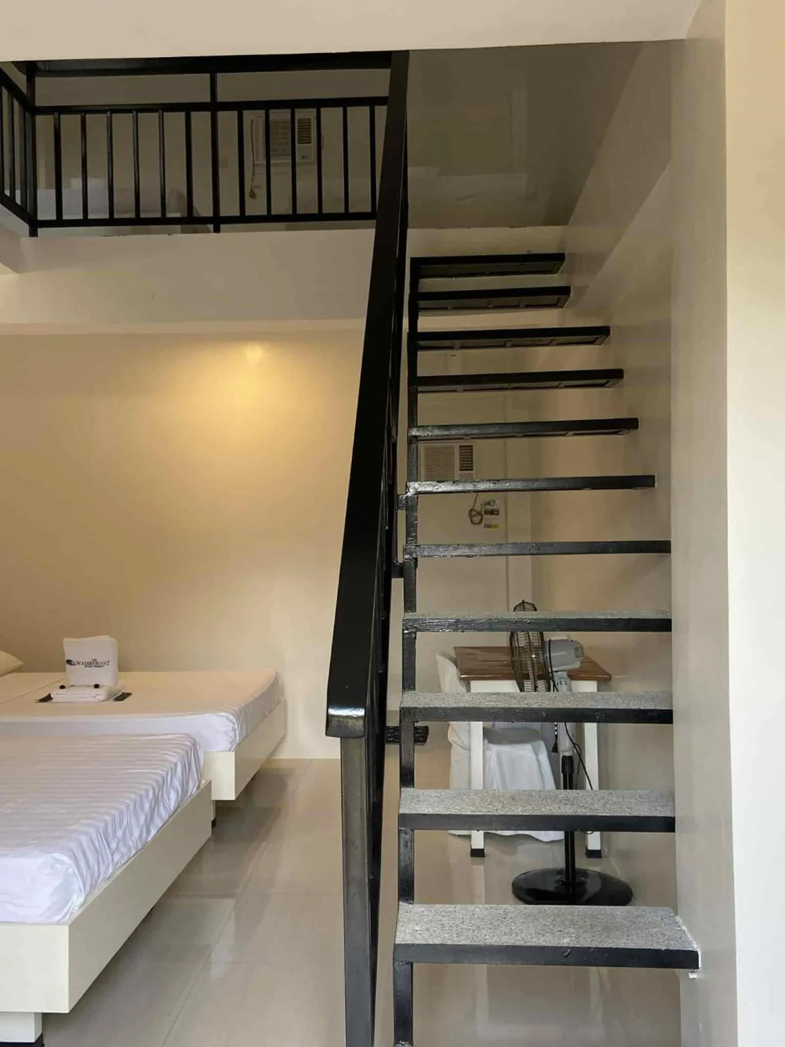 Bed in The Waterfront Beach Resort