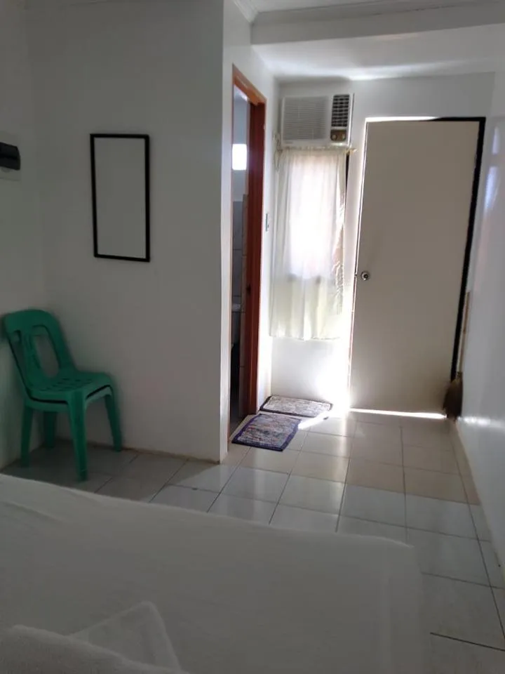 Bed in The Waterfront Beach Resort