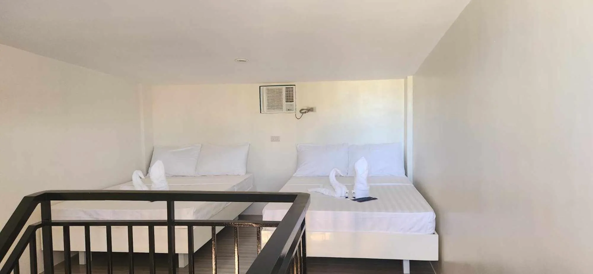 Bed in The Waterfront Beach Resort