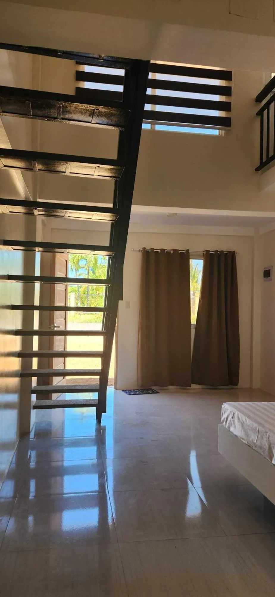 Bed in The Waterfront Beach Resort